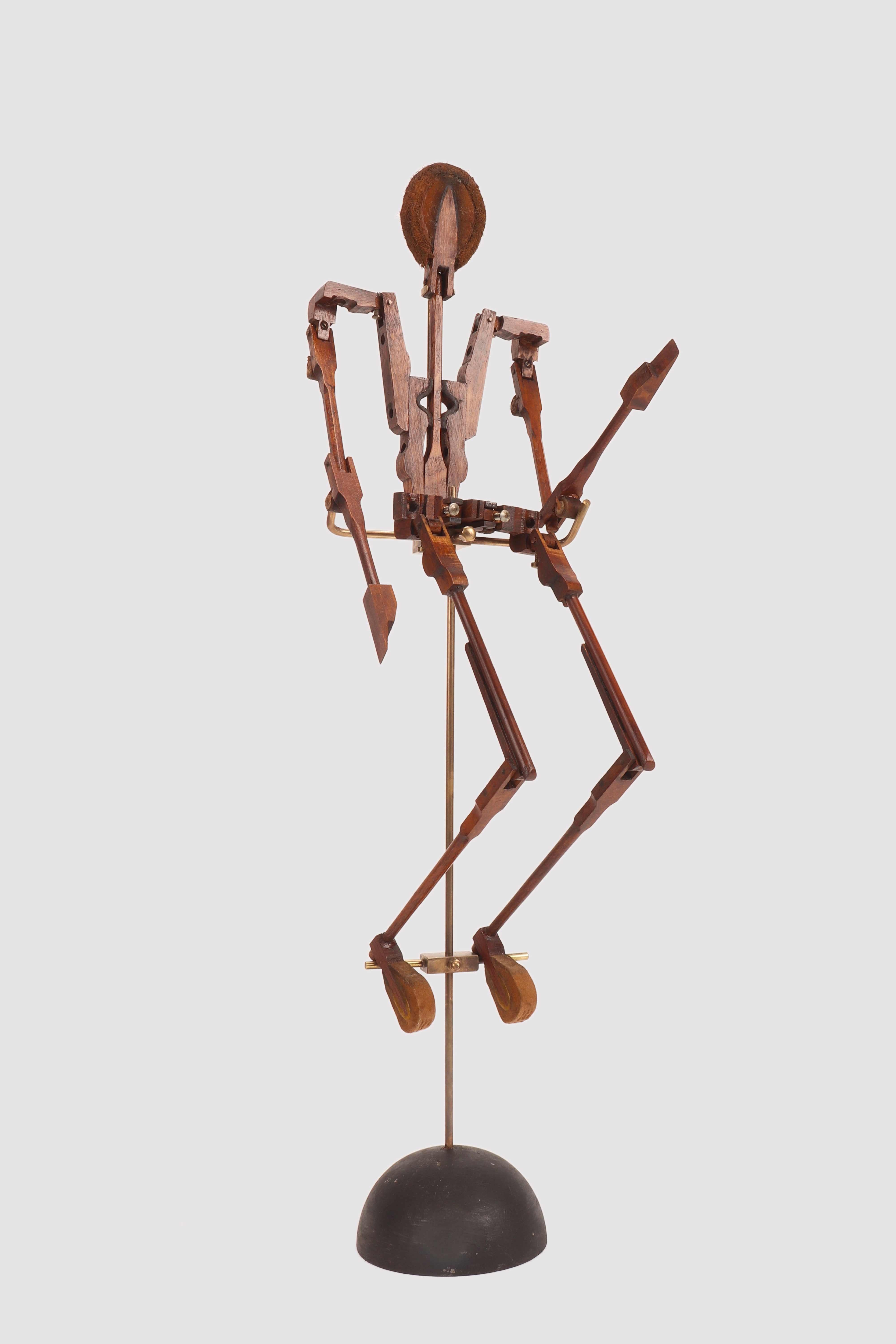 A one of a kind, small articulated mannequin, made with the percussion hammers of 
a pianoforte. The metaphisically shaped feet and face, are made from dampers: these are wooden blocks covered with felt, which 
have a function of suffocating the