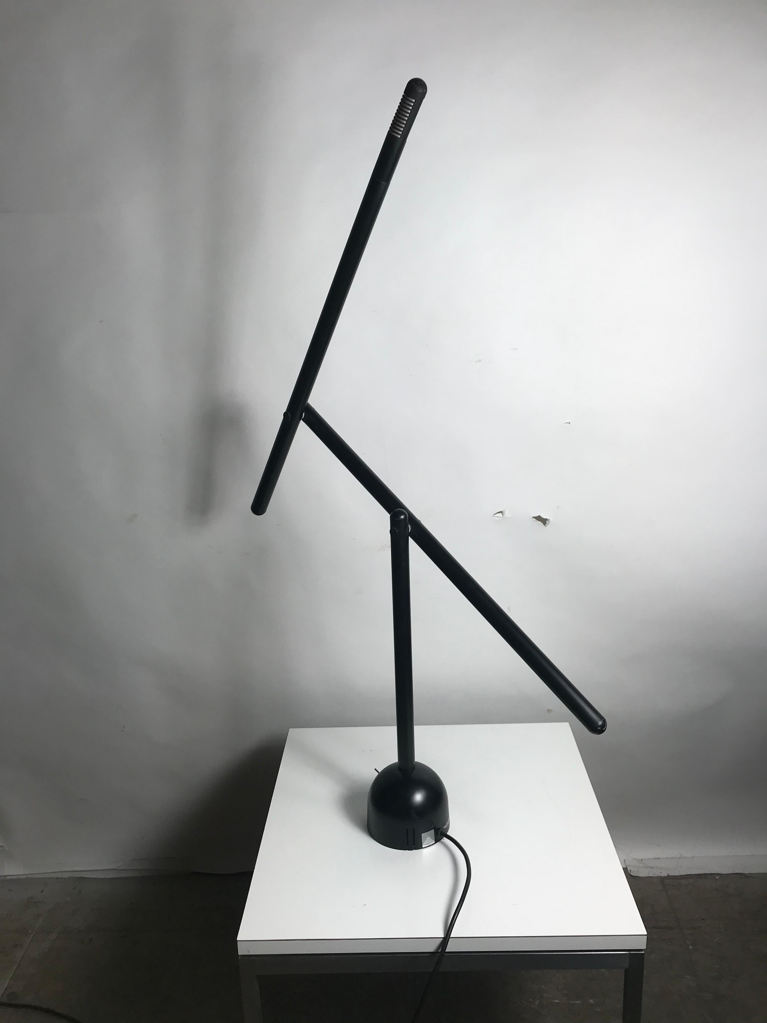 Articulated Mira table lamp by Mario Arnaboldi designed in Italy, limited production, produced for only one year, 1970 Enameled metal and aluminum construction with pivoting head. Original cord. Takes one G9 halogen bulb. Original black finish.