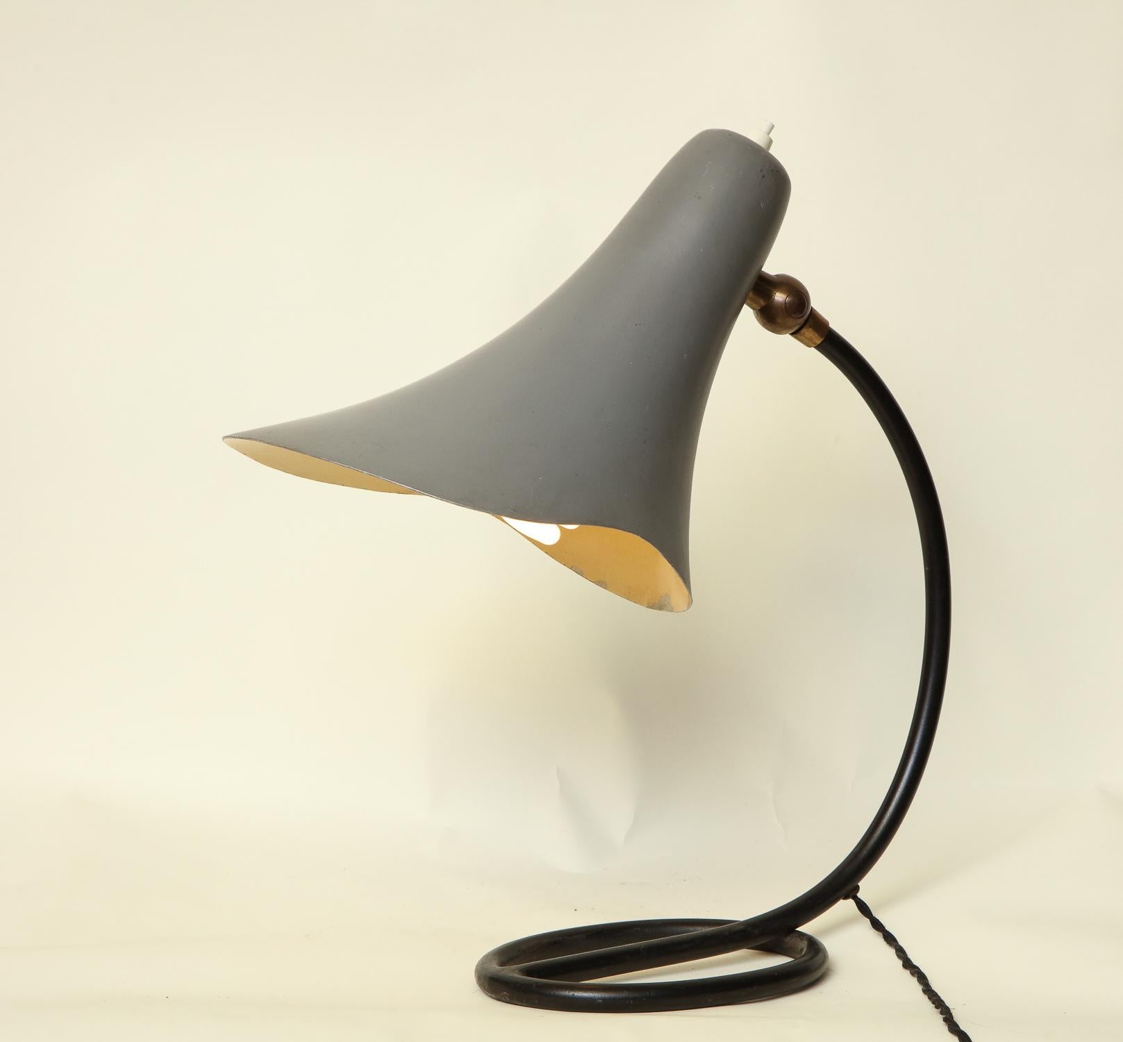 Articulated table lamp Mid-Century Modern painted metal and brass shade adjusts, Italy, 1950s.
New socket and rewired.