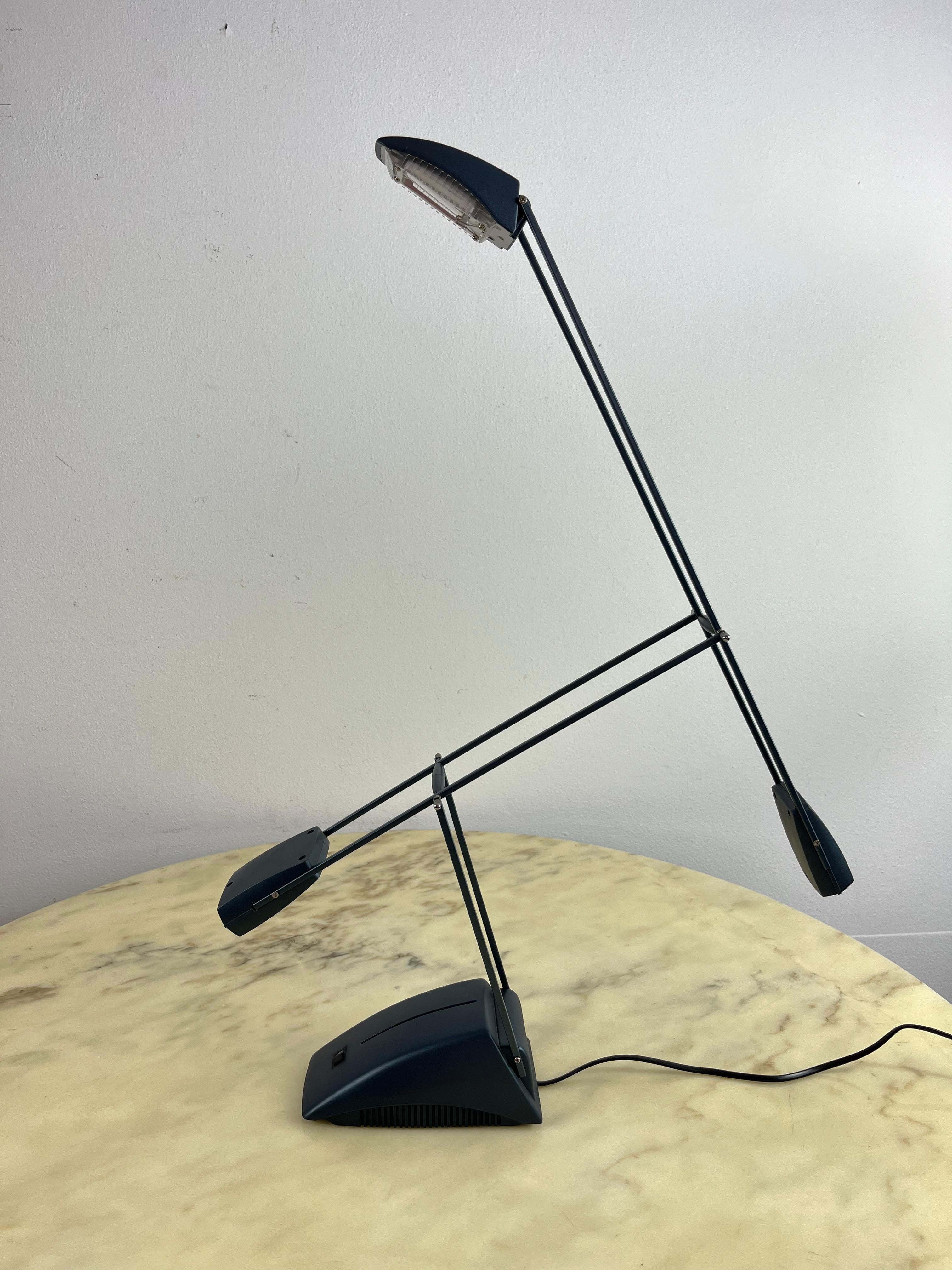 Articulated table lamp with halogen light  1970s
Integral and functioning with dual lighting modes. Good condition, small signs of aging.