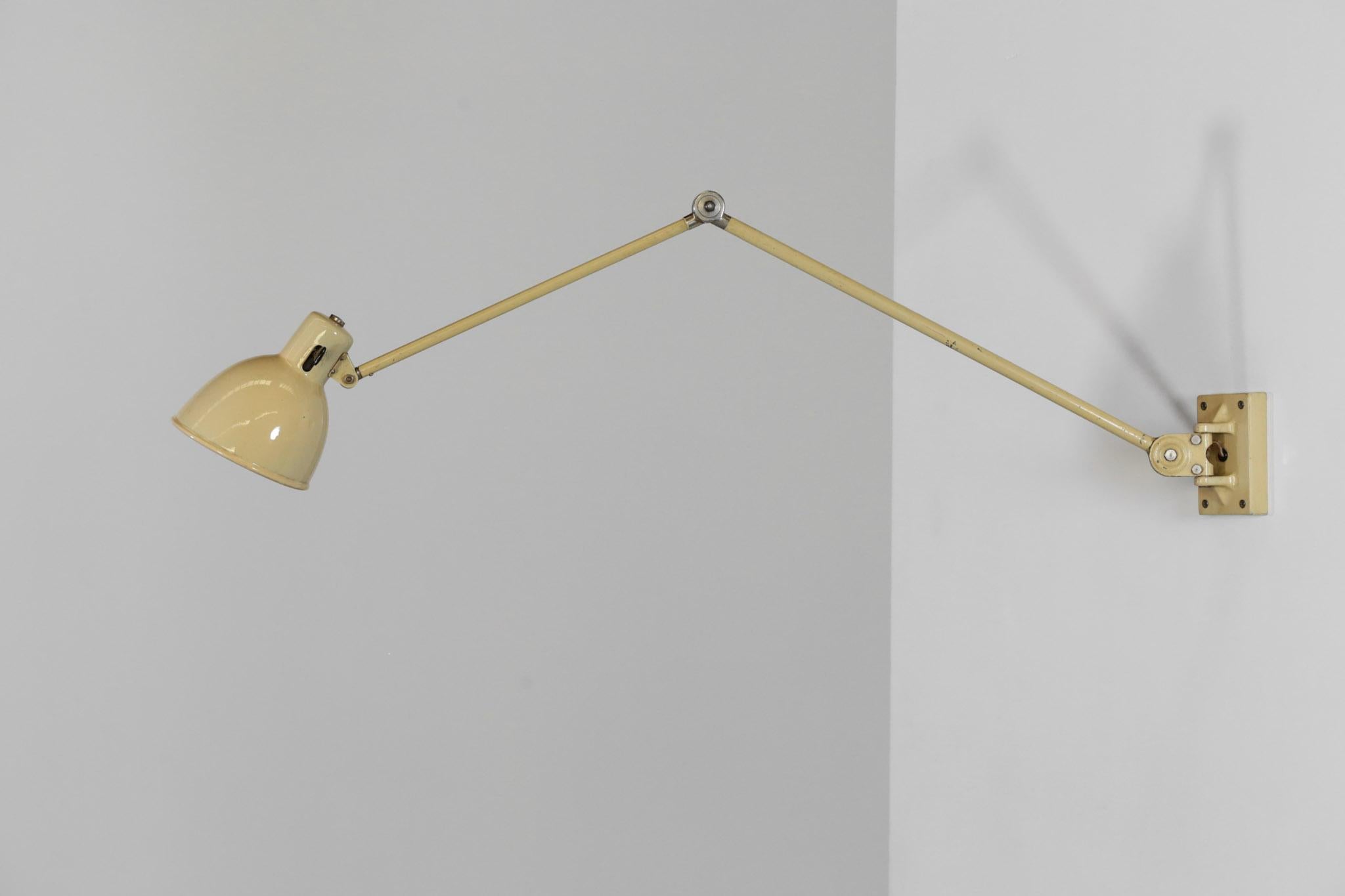 Large wall light from 1960s designed by Switzerland Workshop Bag Turgi.
Articulated lamp made of metal.