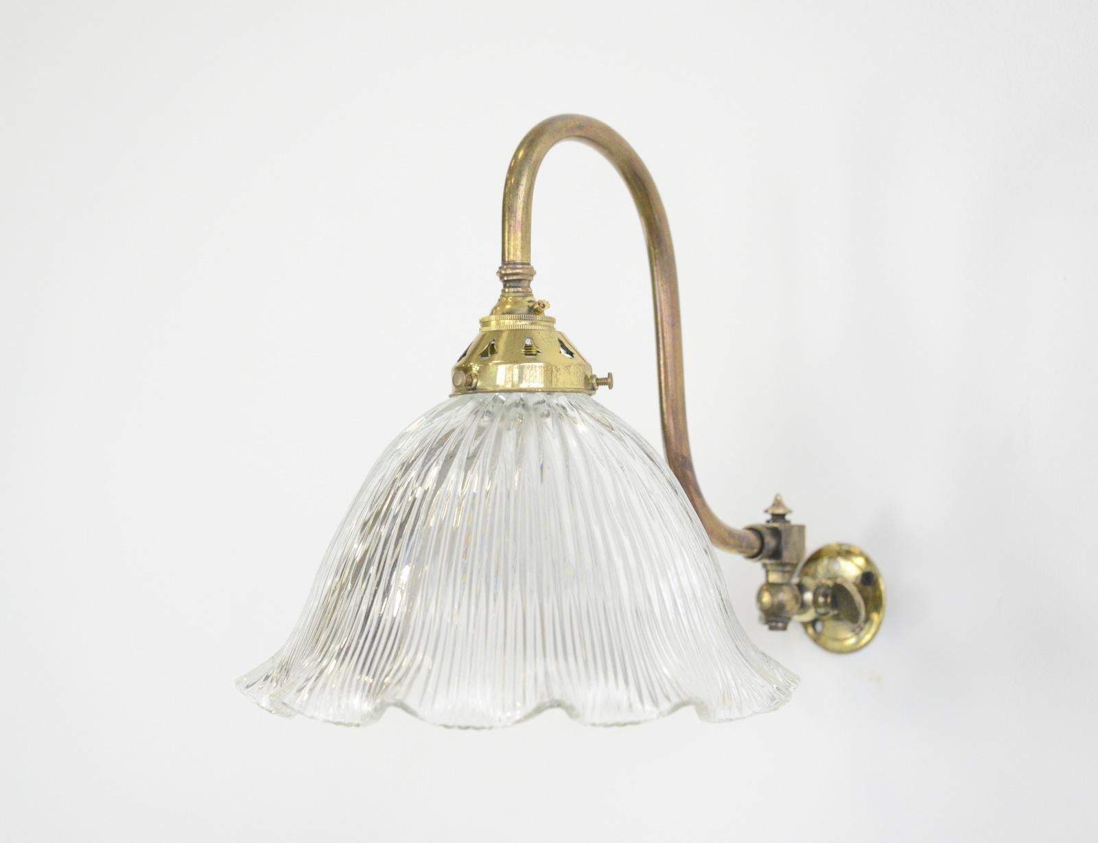 Articulated wall sconces by Holophane, circa 1910

- Price is per light (3 available)
- Articulated curved brass arms
- Fluted prismatic shades
- Takes B22 fitting bulbs
- Wires directly into a wall feed
- English ~ 1910
- 24cm wide x 27cm