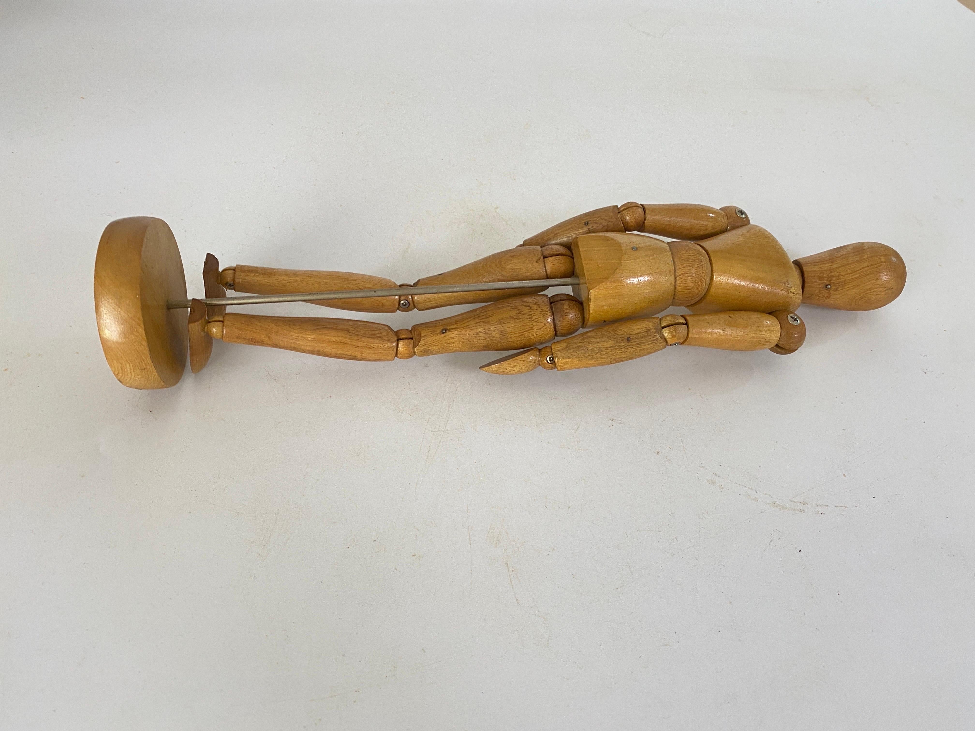 20th century French Articulated Wooden Artists Lay Figure, Mannequin on stand
 
Stunning wooden articulated lay figure from the 20th century in original condition. This item features metal pins, bolts and sprung joints. The figure is attached to a
