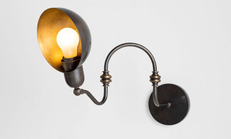 Articulating brass gooseneck sconce, Italy 21st century.

All brass wall light with multiple points of adjustment.

*Please Note: This fixture is made in Italy, and comes newly wired (eu wiring). It is not UL Listed. Standard Lead Time is 4-6 Weeks*
