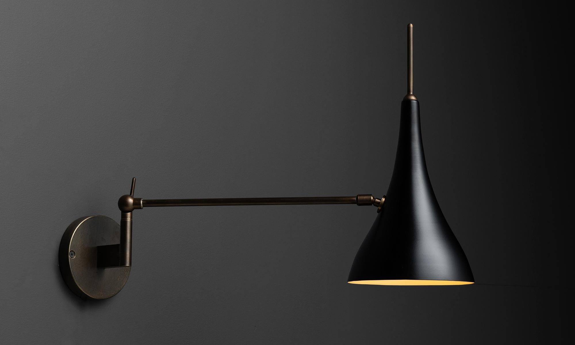 Articulating wall sconce

Made in Italy

Black metal & brass fixture, pivots left to right as well as the shade moves in all directions.

Measures: 6.5”w x 21”d x 16”h.