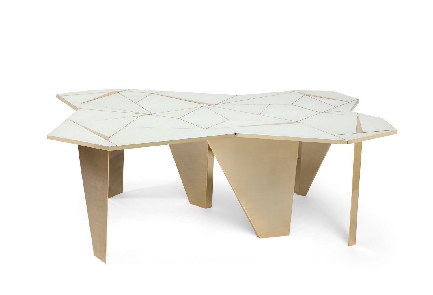 Studio-built table of hand carved glass panels set into brass framing and colored with a unique iridescent treatment. Irregular brass legs that come up through the top, creating abstract triangular surface details. Limited edition of 12, plus 2