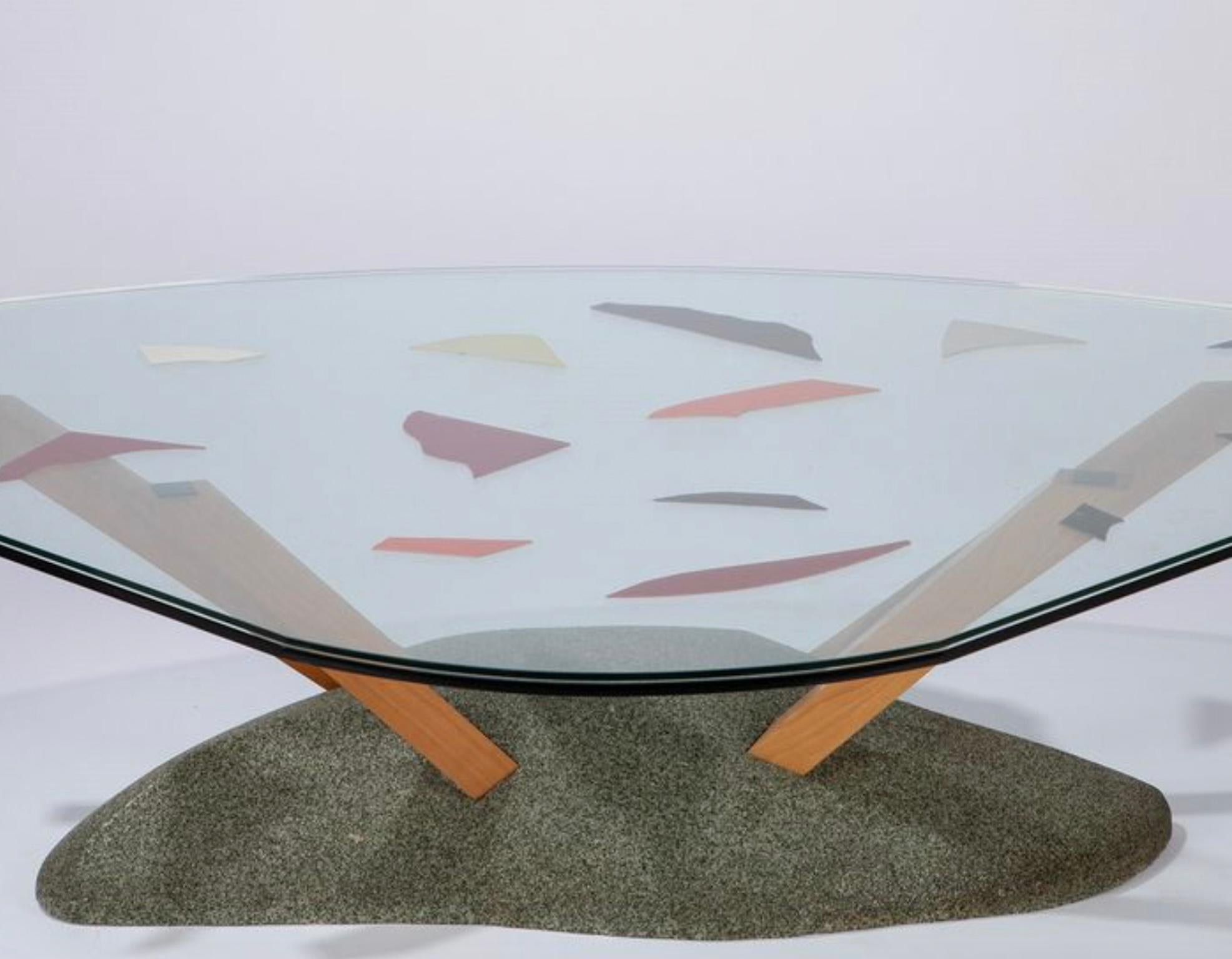 Coffee table desiged by Paolo Deganello and produced by Cassina in 1985. Base in sand, quartz and polyester, wooden legs and glass top.

Biography
Born at Este, Padua, in 1940, Paolo Deganello graduated in architecture at Florence in 1966, From 1963