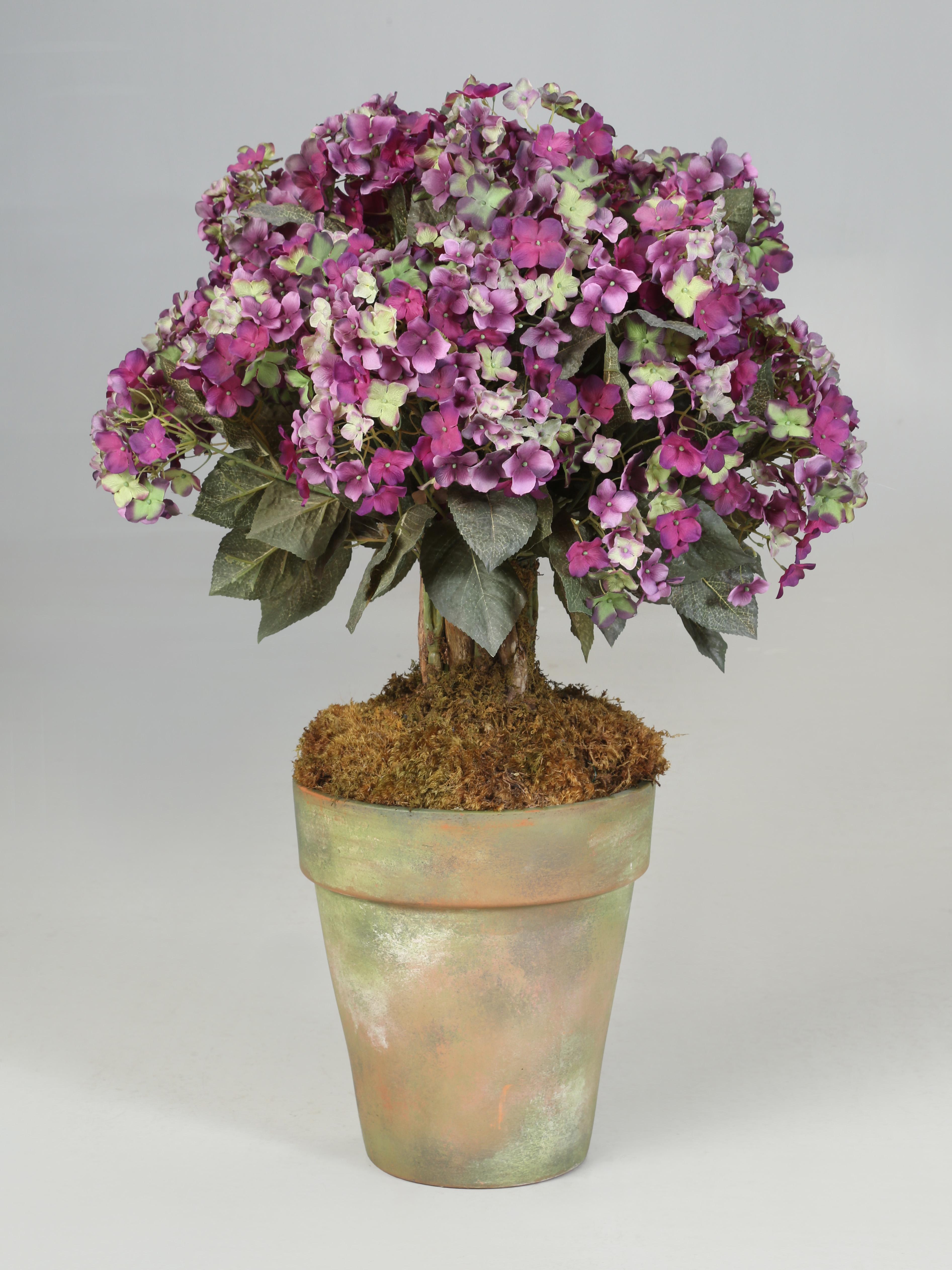 Beautiful Artificial Floral Arrangement of Purple Hydrangea that were purchased to be used in the showroom for a center hall table or Dining Table Centerpiece. During some long over do cleaning of our storage facility, we found a couple of