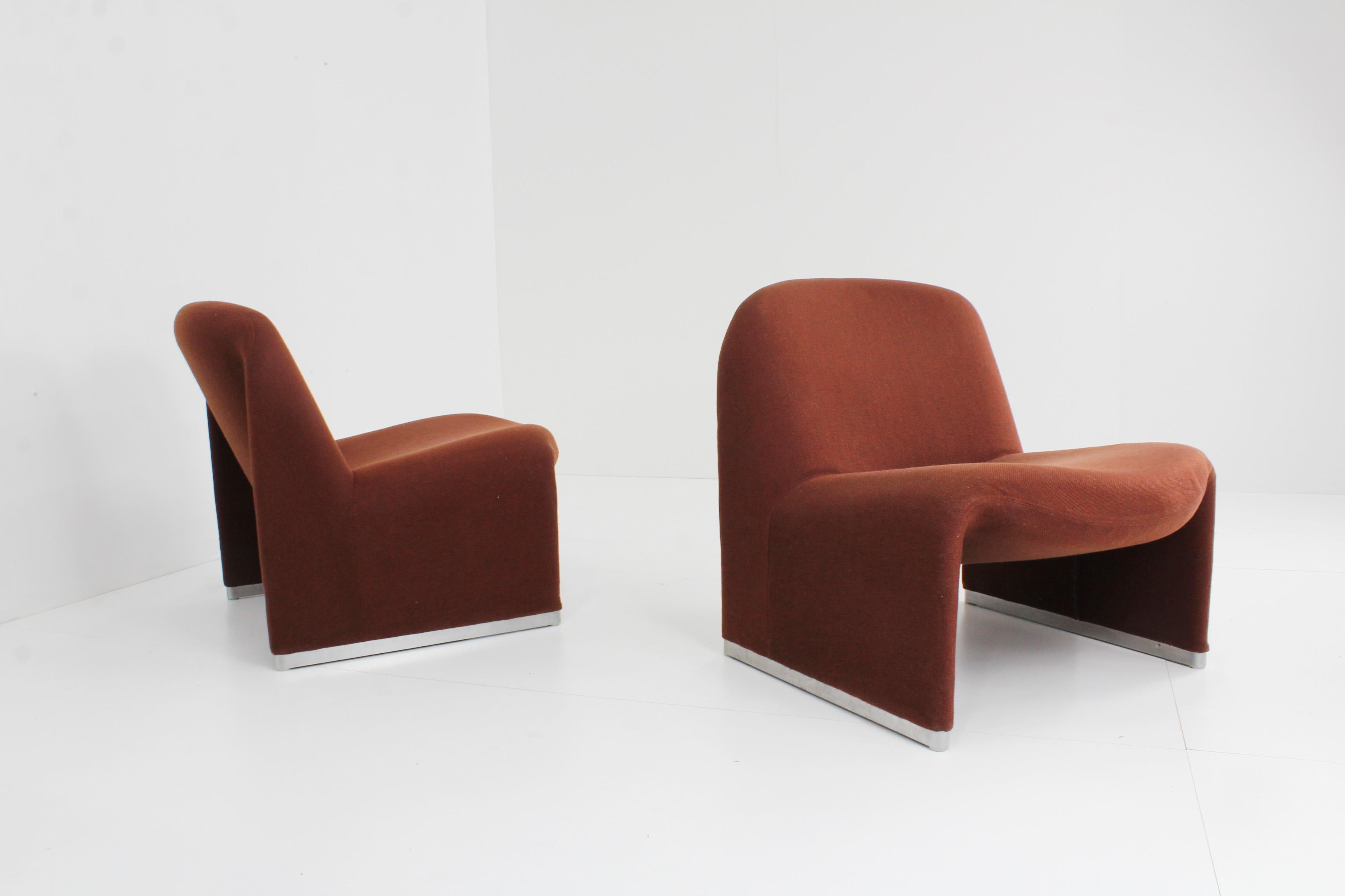 Artifort Alky design armchair designed by Giancarlo Piretti in a beautiful warm colour. 
2 Identical alkys available, price is per piece, both separately and per set

The chairs are vintage but are in a very good condition.