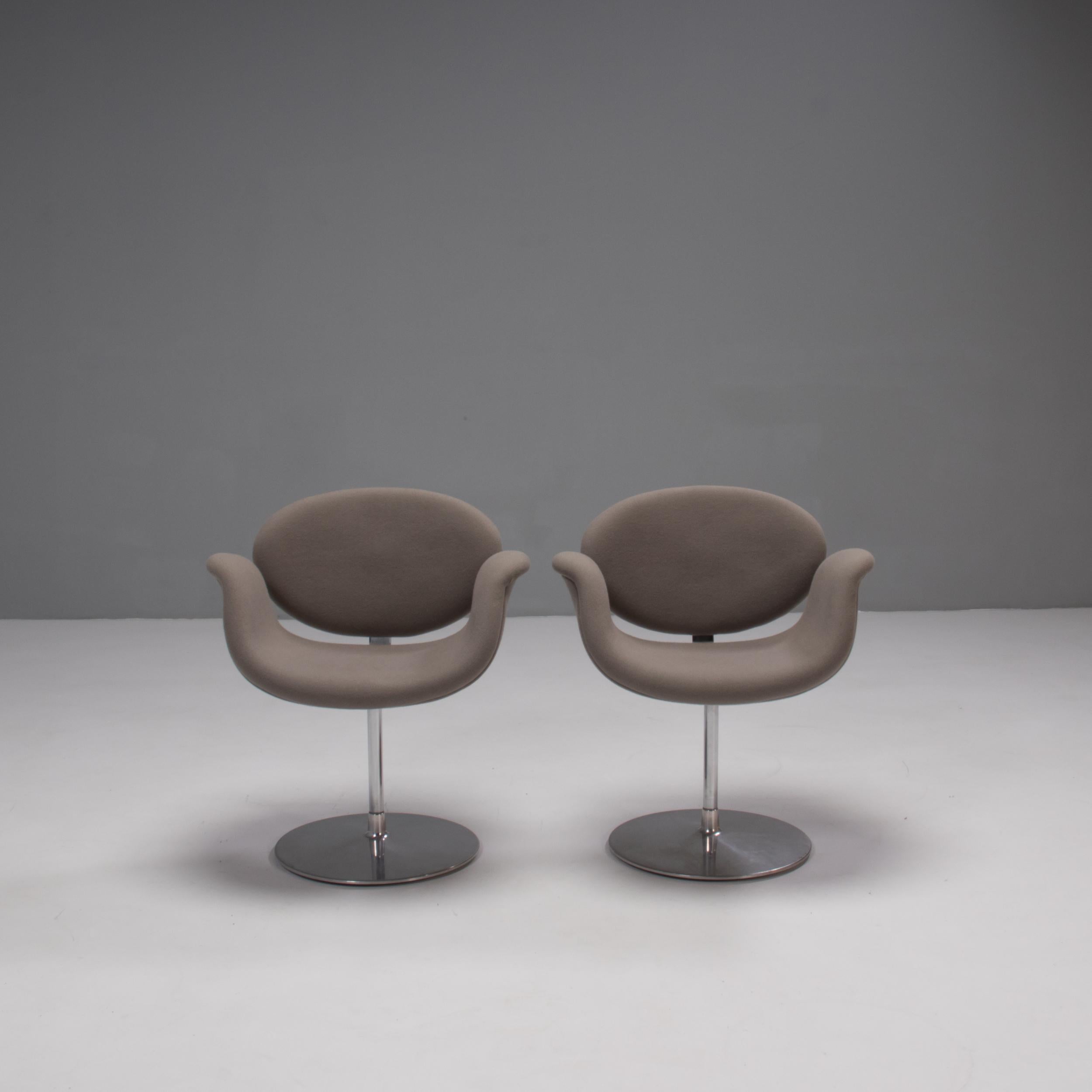 Originally designed by Pierre Paulin in 1965, the Little Tulip Chair is a design icon.

Inspired by the flower, the chair has a Tulip-esque silhouette with a petal shaped seat which curves out to create armrests.

Upholstered in grey fabric, the