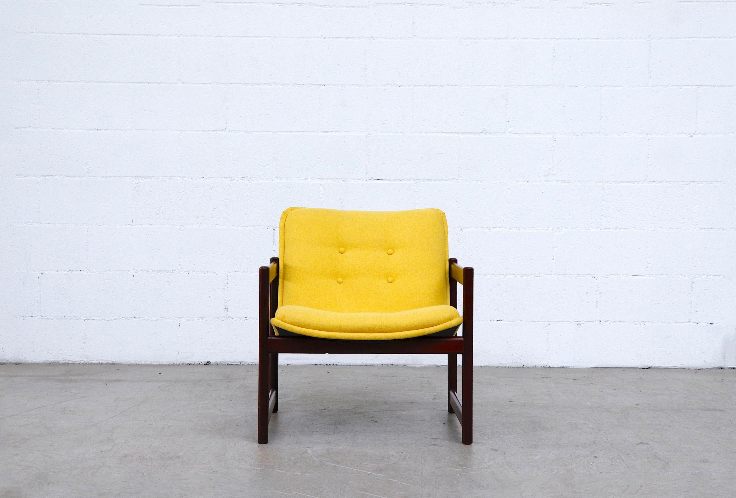 Handsome mahogany cube framed Artifort lounge chair in new sunshine yellow upholstery.