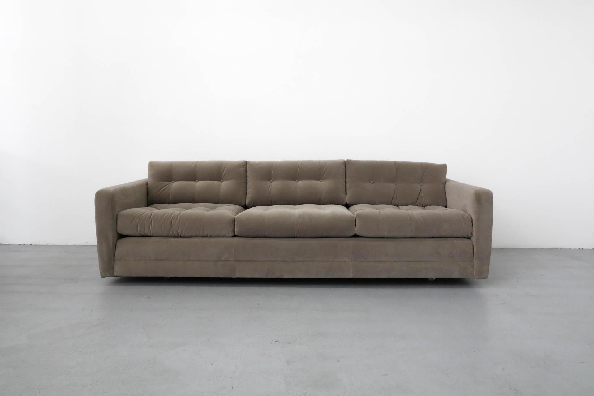 Gorgeous Mid-Century Artifort three seat tufted sofa reupholstered in Knoll Textiles fabric Ooh La La - Taupe #K22012. Very comfortable large sofa with tufted cushions, high armrests and wheels for easy rolling.