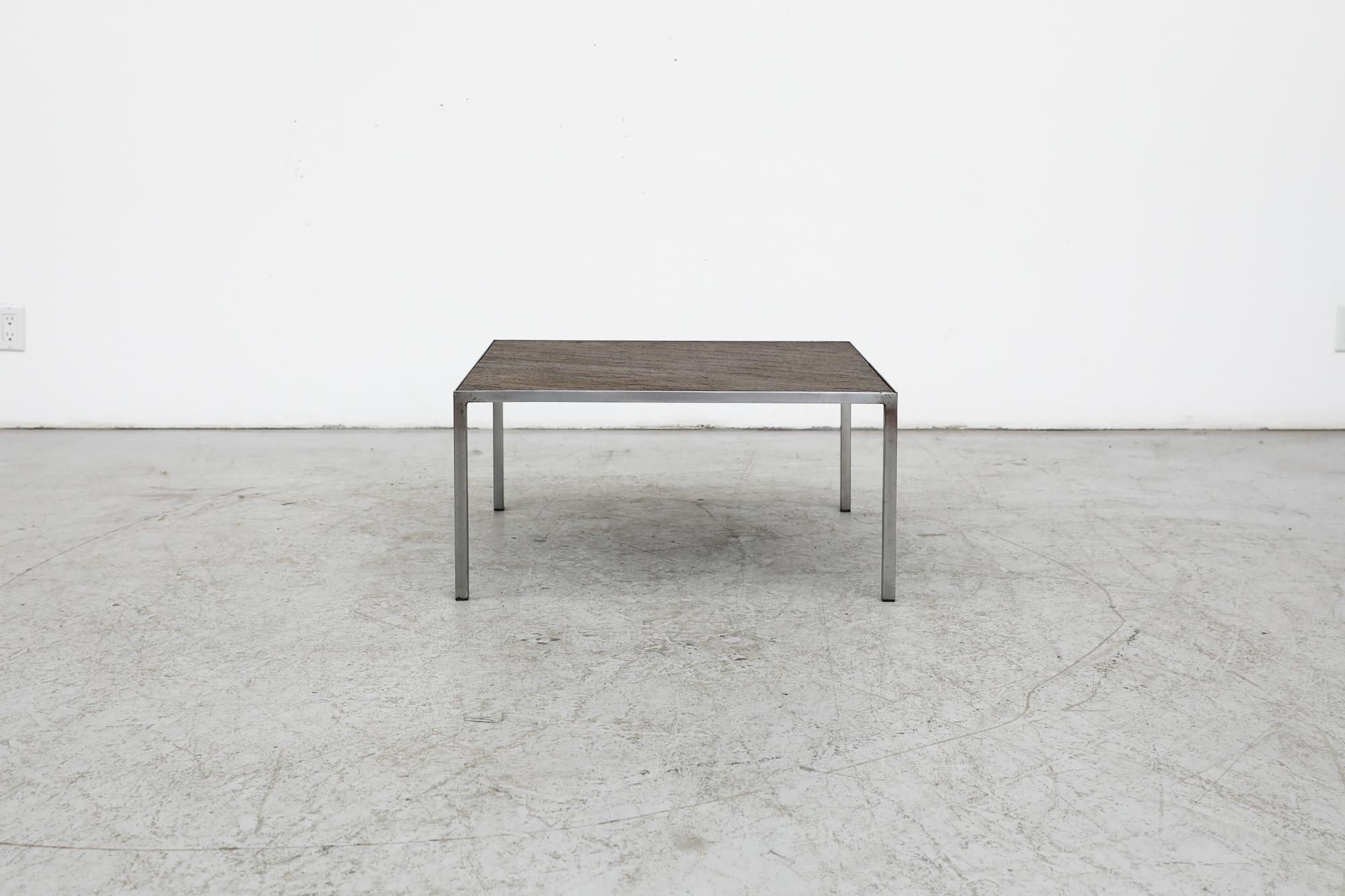 Dutch 1960s Artimeta square coffee table or side table with thin chrome frame and inset bronzed stone top. In original condition with visible wear including chipping and scratching. Wear is consistent with its age and use.