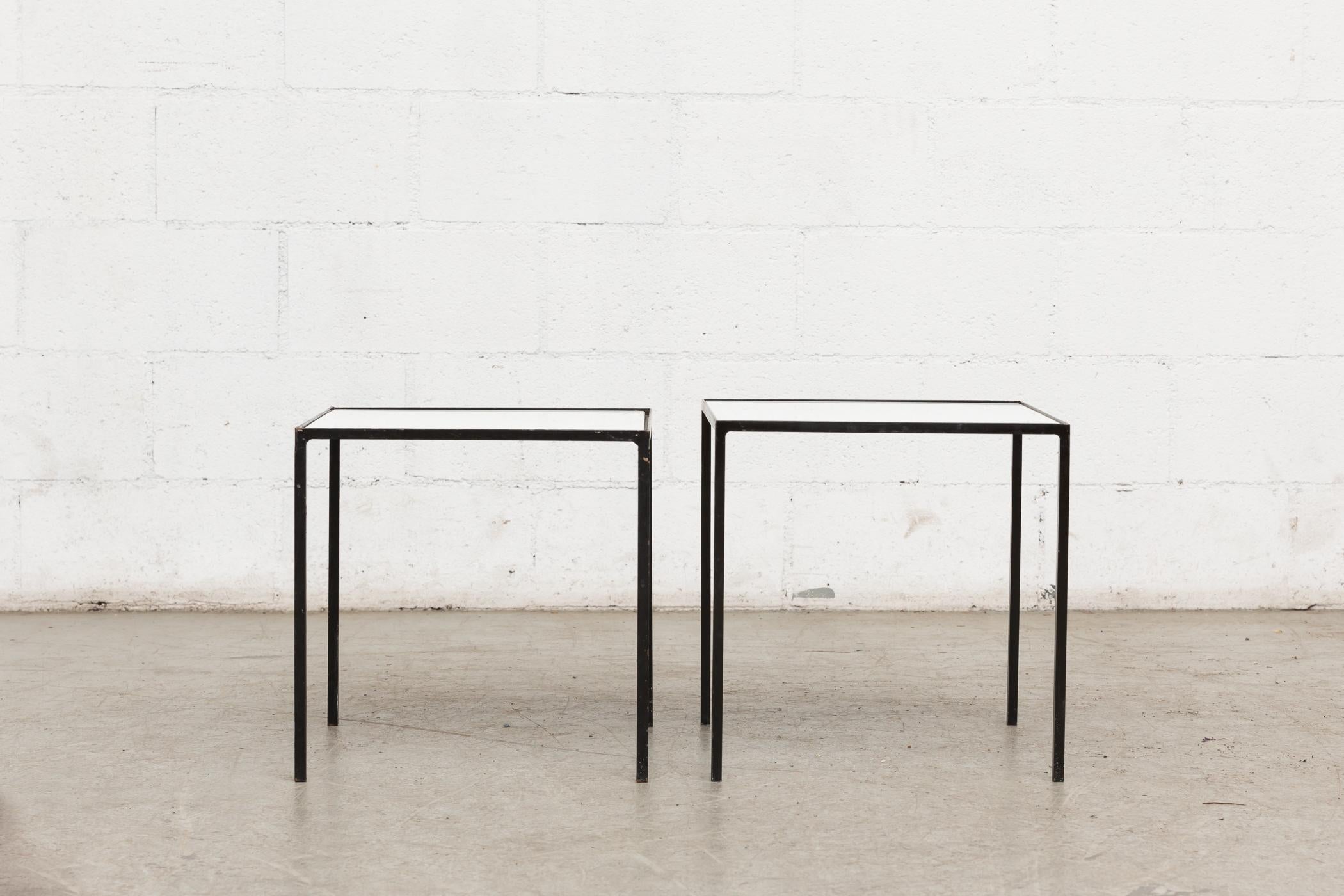 Almost identical Artimeta white glass side tables with black enameled metal frames. Both in original condition. Sold separately. First measures: 15.75 x 15.75 x 16
Second measures: 16 x 16 x 16.24.
