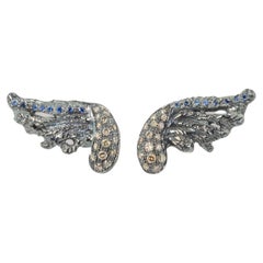 Rossella Ugolini  Boucles d'oreilles en or 18K 0.30K Diamants Plume Saphirs Bleus