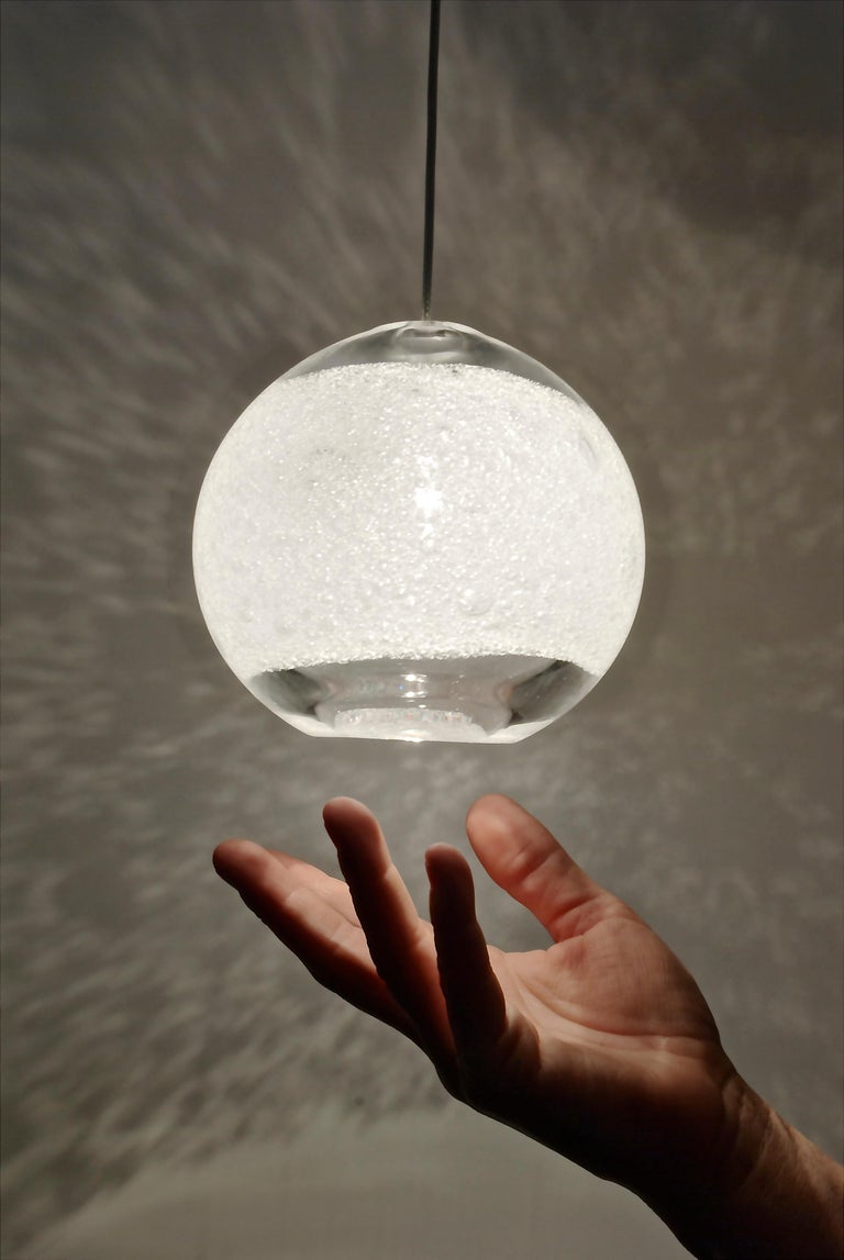 Blown glass shade, clear bubble orb pendant light, cord and canopy included, made in USA by Caleb Siemon and Carmen Salazar
Glass measures: 4.5