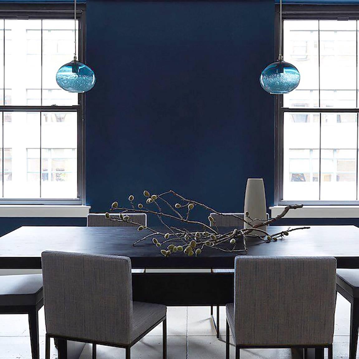 Steel Blue Ellipse Bubble Pendant • Hand Blown Glass • Made in USA
Various Canopy, Cord, and Shade Colors Available

These works continue the language of contrast of the lattimo and banded lines but use with a swath of textured whipped glass. This