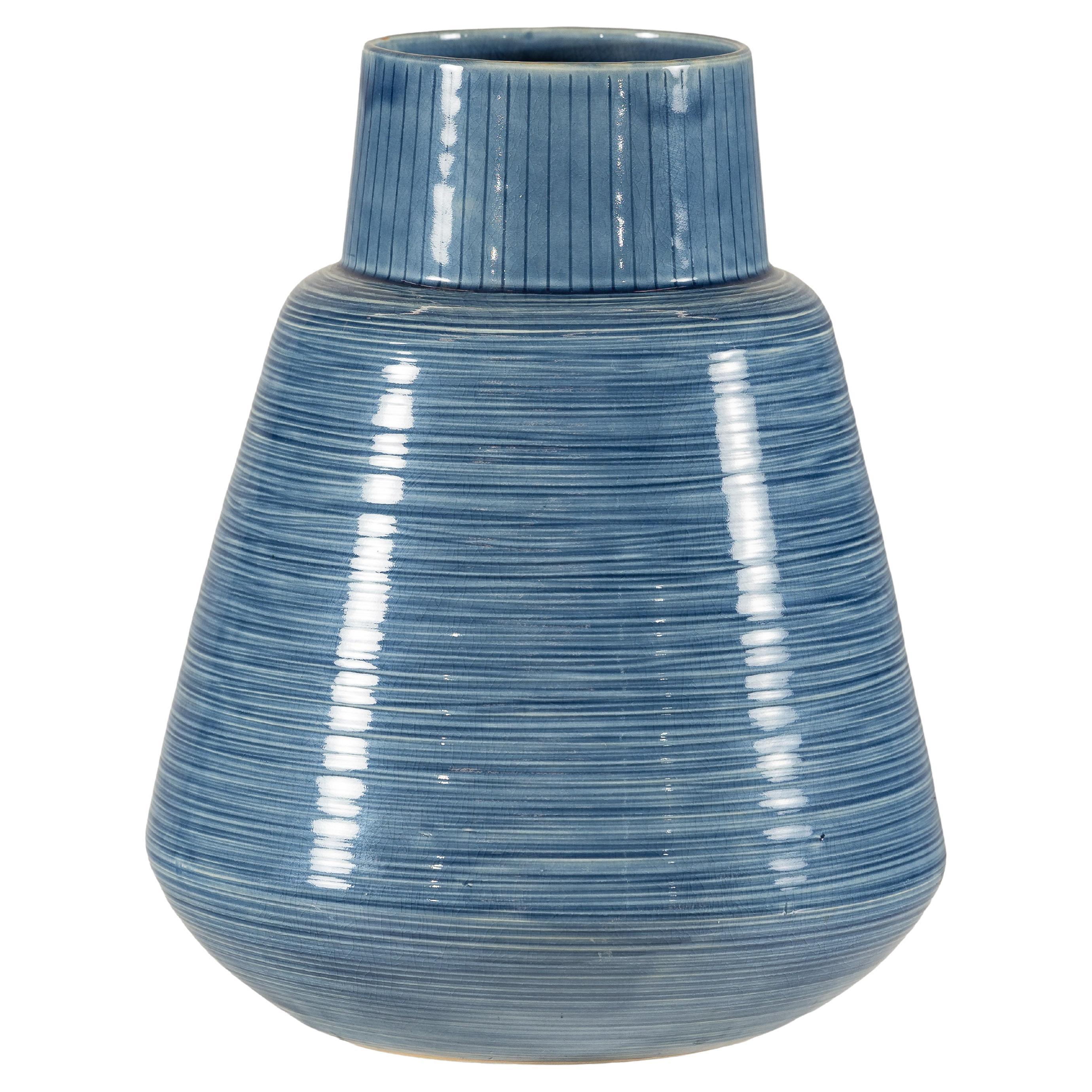 Artisan Blue-Glazed Ceramic Vase with Ribbed Surface and Tapering Form For Sale