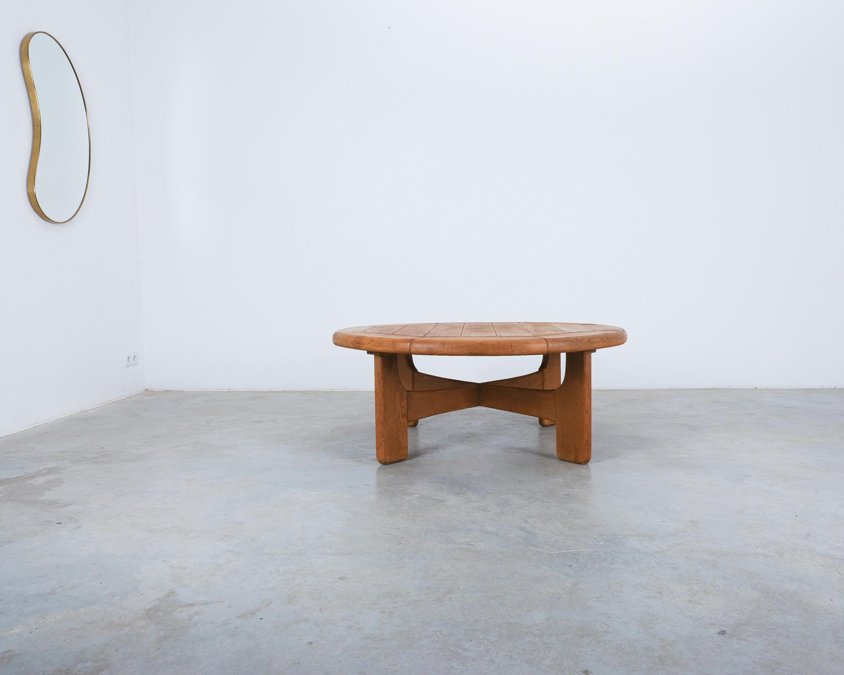 Artisan brutalist oak coffee or outdoor table, France, 1950

Artisan rustic coffee table, large and round, France, 1950. Unique, handmade solid oak-tree table from planks of wood. Perfect for an outdoor situ porch or patio or a setting . Very heavy