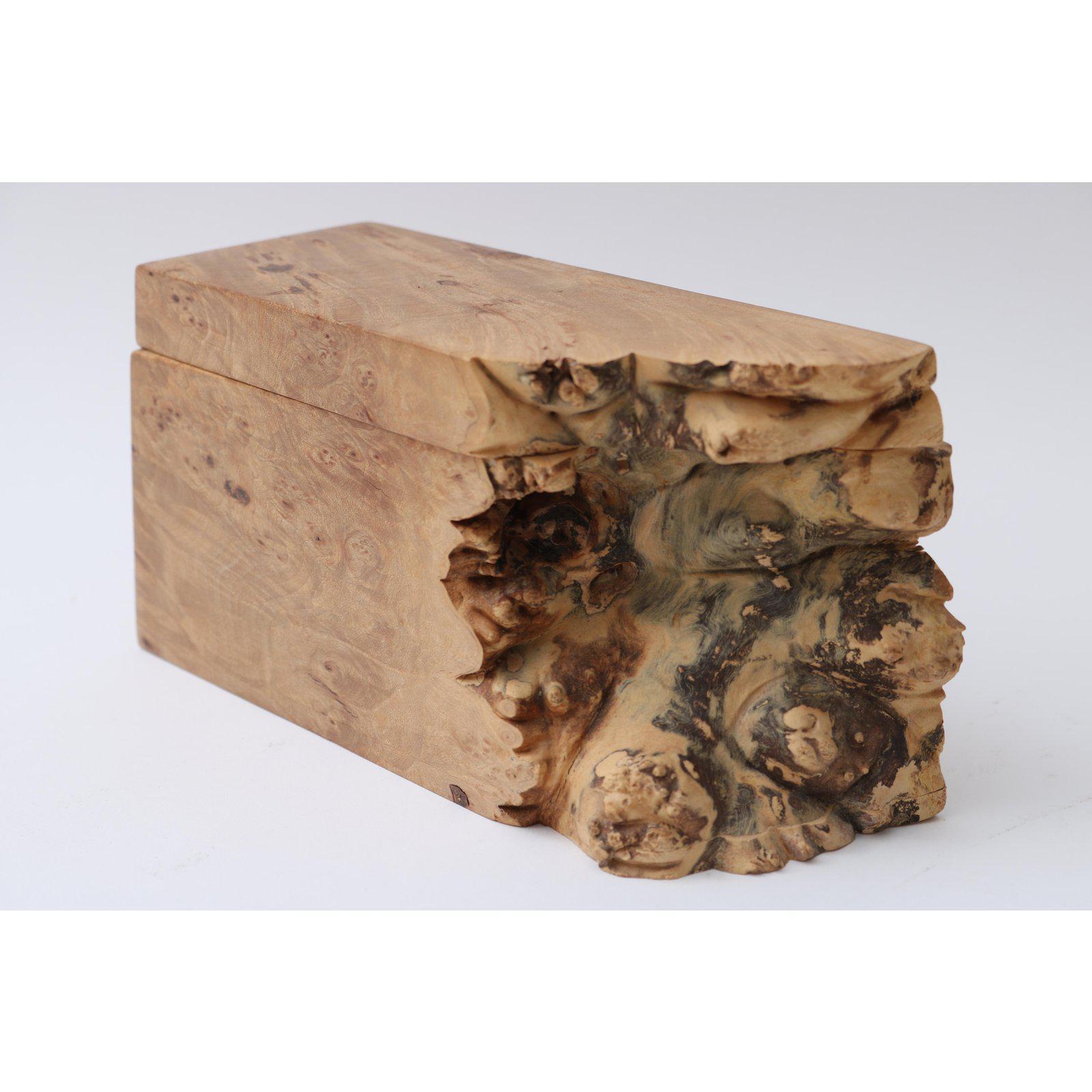 This stylish, organic burl wood box was created by the American artisan Michael Elkan.