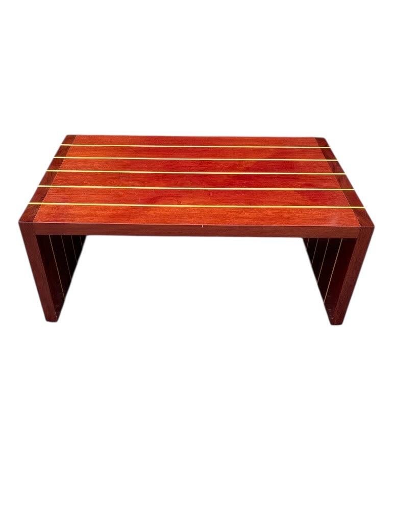 This exquisite artisan table or bench showcases exceptional craftsmanship and elegant design. Measuring 39.5 inches in length, 23.5 inches in width, and 16 inches in height, this versatile piece features a stunning solid cherry wood top, mahogany