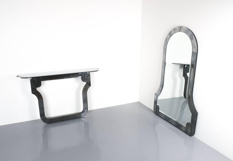 Artisan console table and mirror glass Neo-Baroque, Italy, 1980. High quality Murano glass console table with bevelled rim and a matching mirror in the same style. The base material is wood which has been covered in mirror glass with an artificial