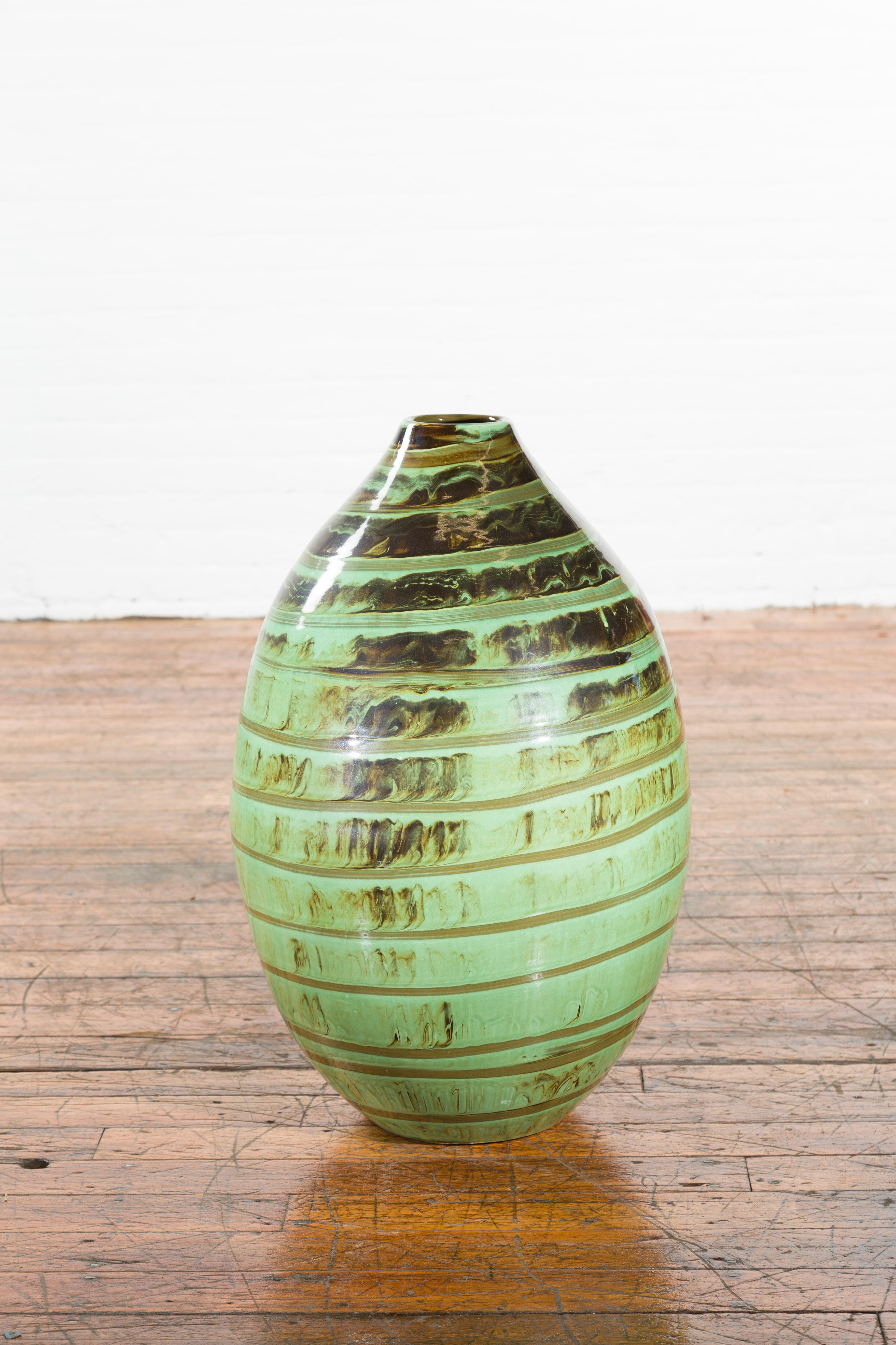 Thai Large Olive-Shaped Ceramic Vase with Spiraling Green and Brown Glaze For Sale