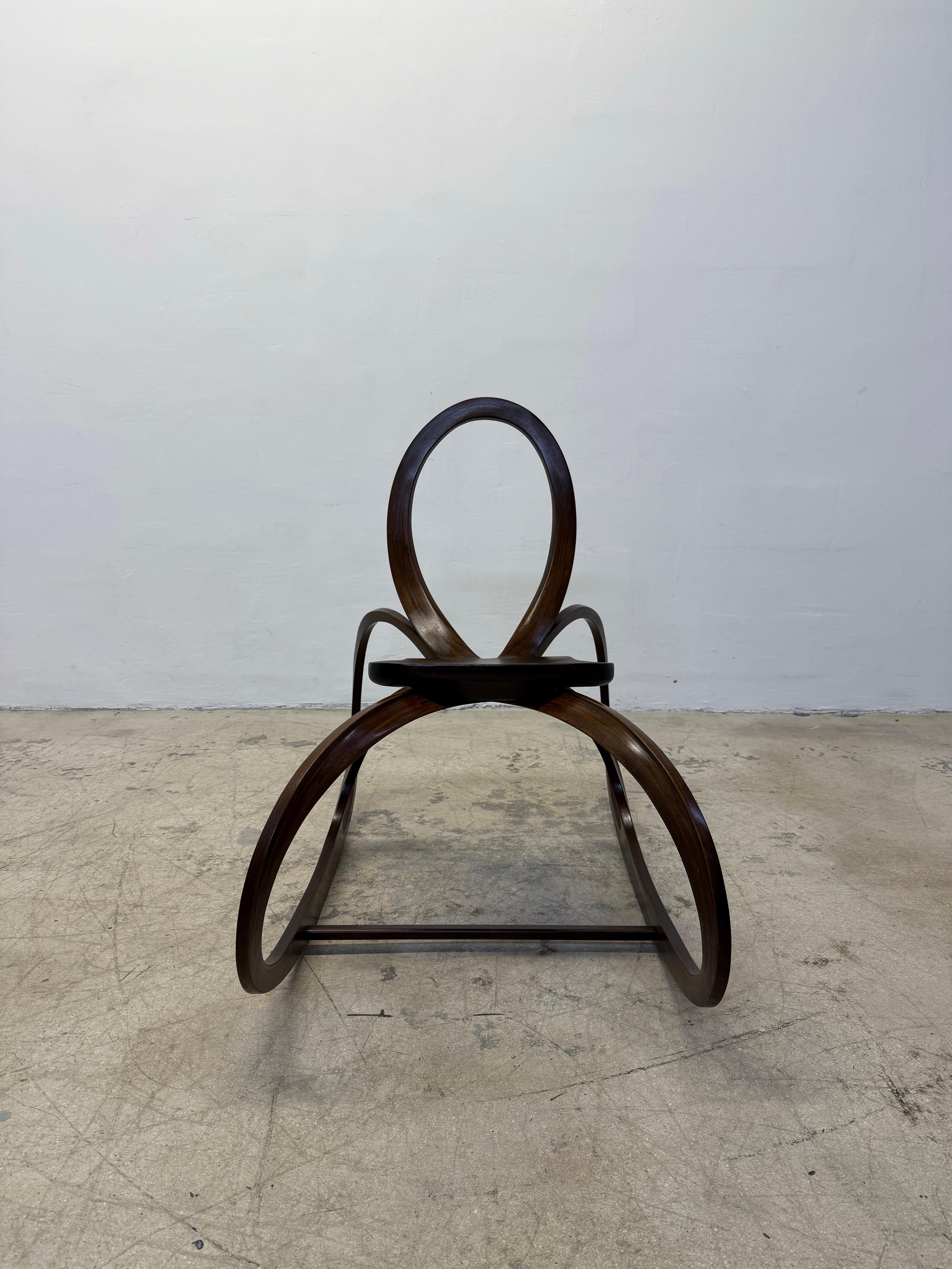 Sculptural organic modern rocker crafted from wood by unknown artist, 1980s.  Maintains artist signature on underside.