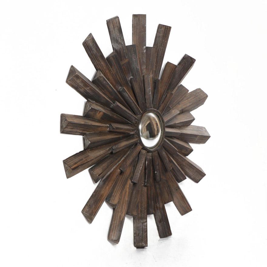 Sunburst mirror, artisan constructed from old barn wood then waxed, creating a cerused effect. The center is a small convex mirror with antiqued silvering. Each piece is hand sawn in an elongated triangular shape, not flat like some mass-produced