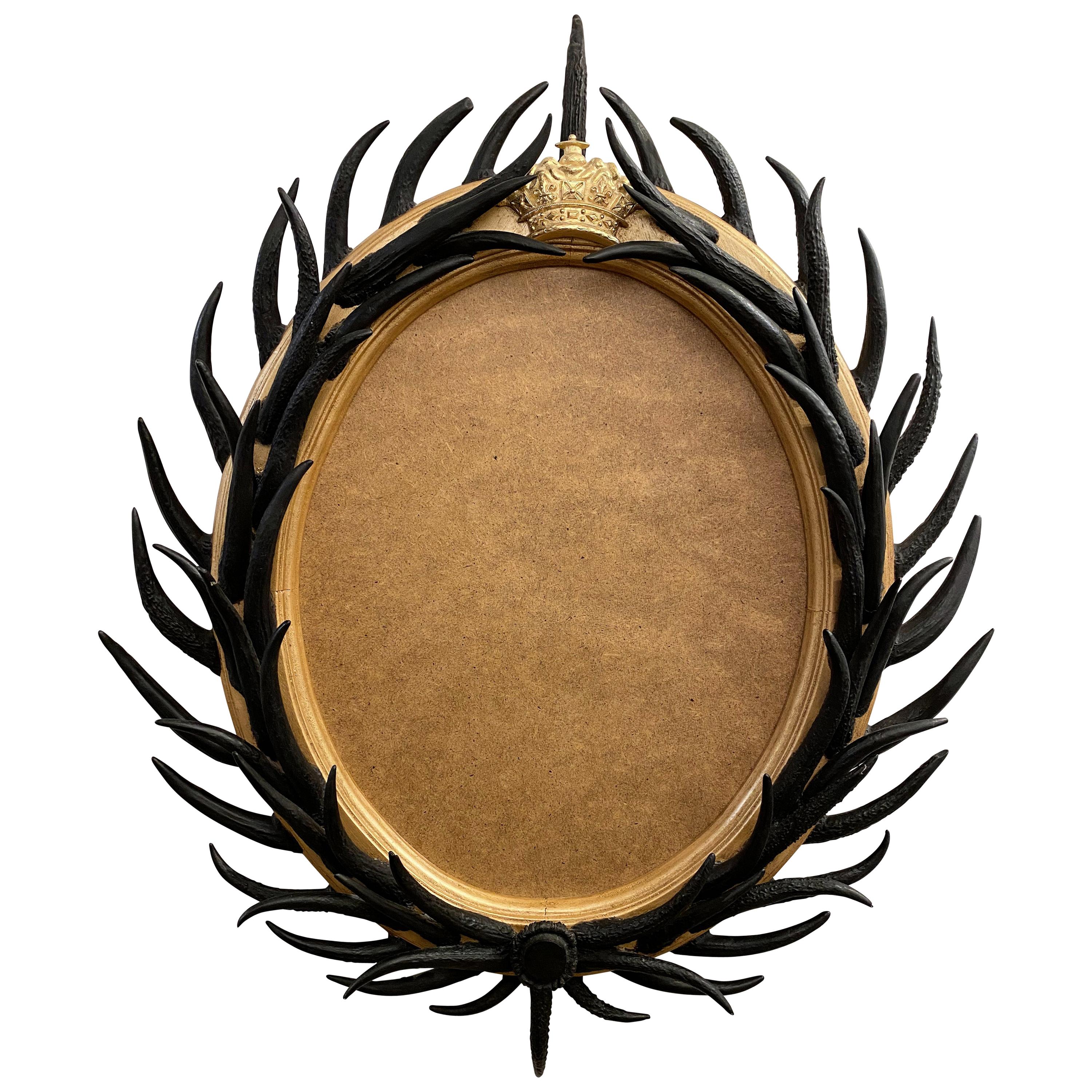 Artisan Designed Dark Antler Oval Mirror with a Crown Motif