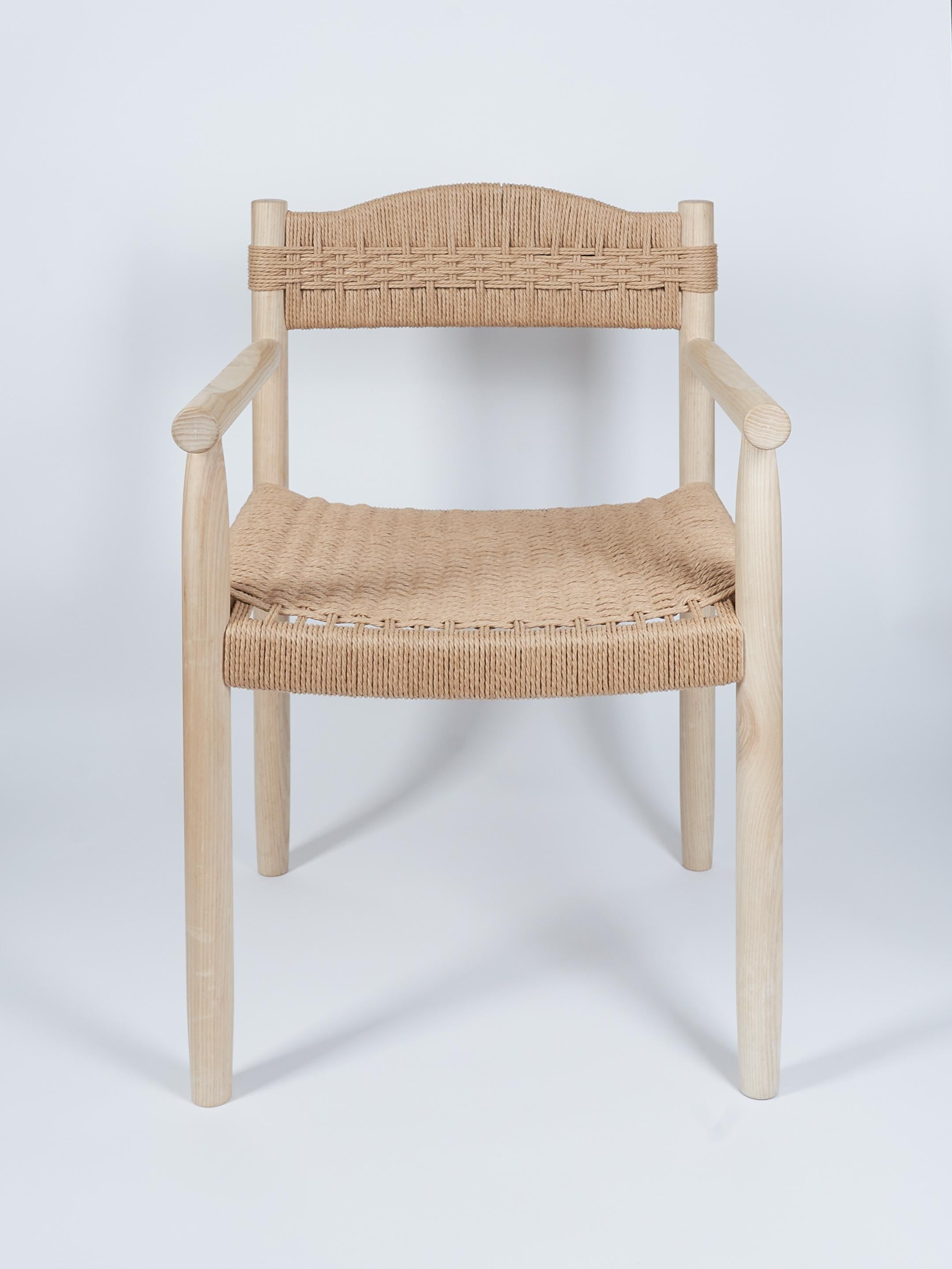 The Dining Chair in Ash with Handwoven Danish Cord Seat and Back is designed and handcrafted by Valeriy Khvan.

Rooted in the elegance of Scandinavian design, this handcrafted dining chair pairs clean lines with timeless materials. Made from solid