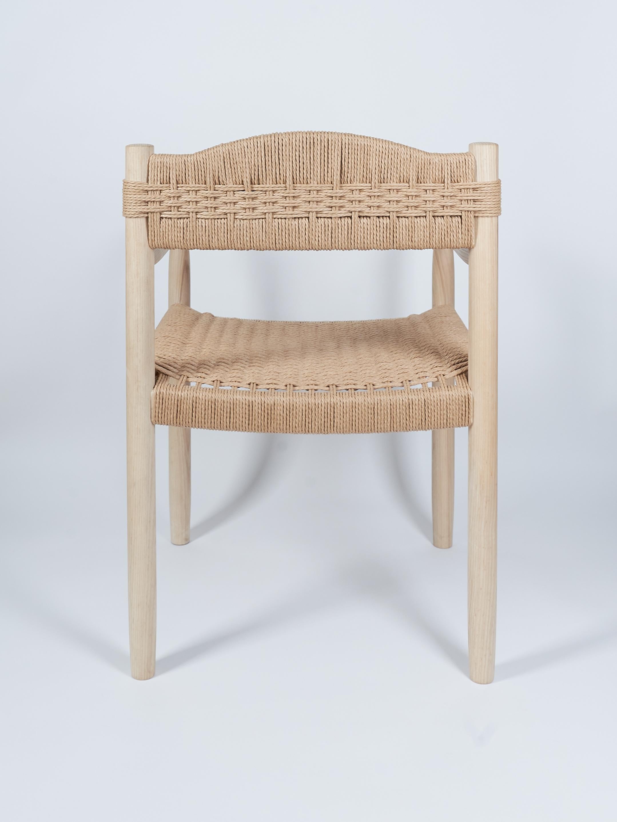 Hand-Crafted Artisan Dining room chair in ash - Woven Danish cord seat and back. For Sale