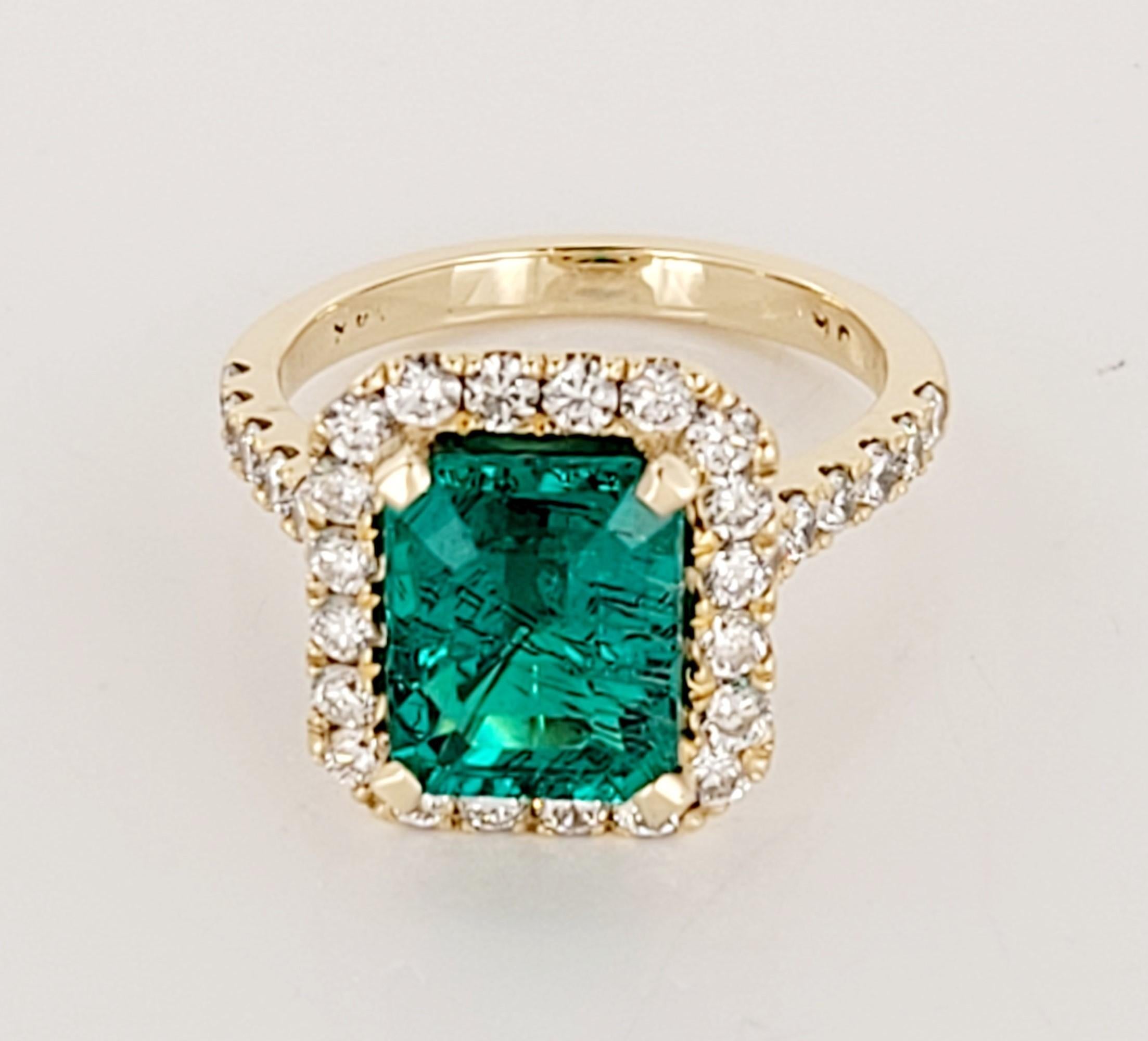 4.75 carat Columbian Emerald (Diffused). Diamond white 1.25 carats in total, Approximately G color and VS clarity.  Size 7

Type: Artisan
Color: Green, Yellow
Stone cut: Emerald Cut
Stone: Emerald
Style: Art Nouveau, Late 20th Century
Item