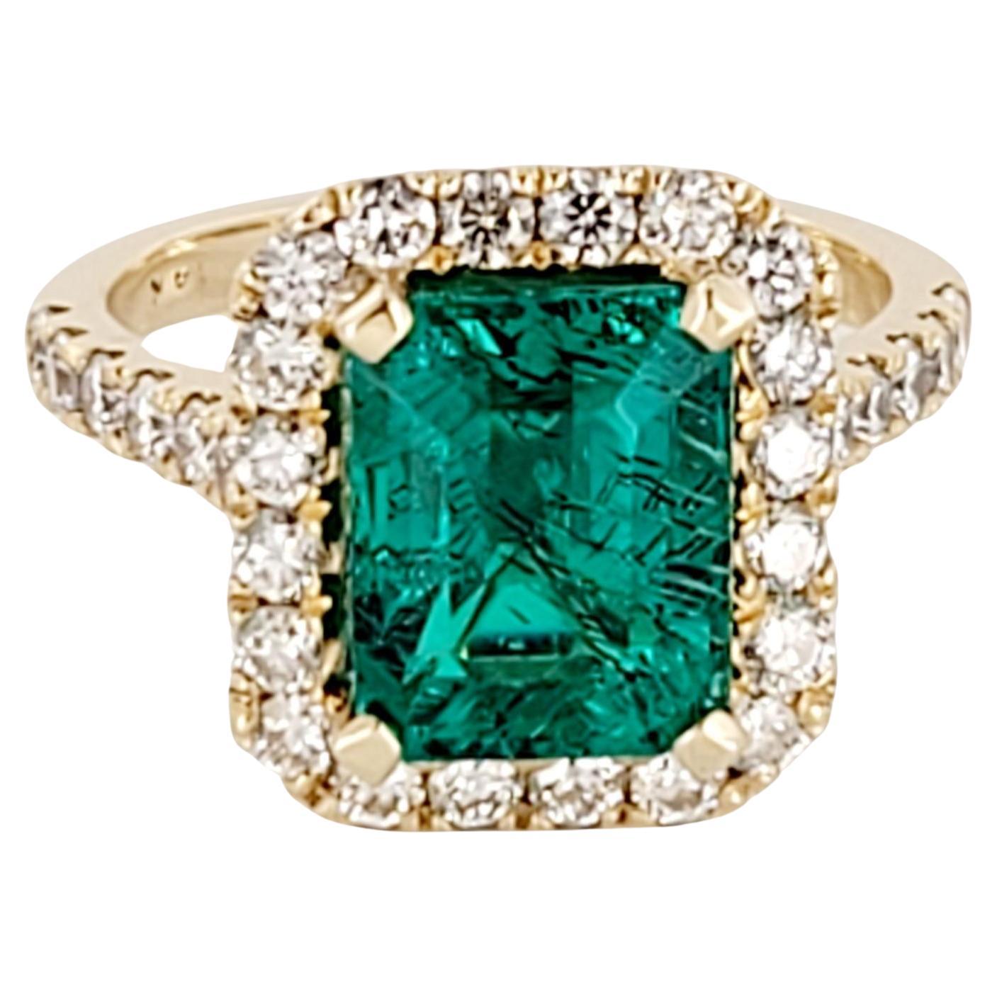 Artisan Emerald Cut Emerald Ring with Diamonds en vente