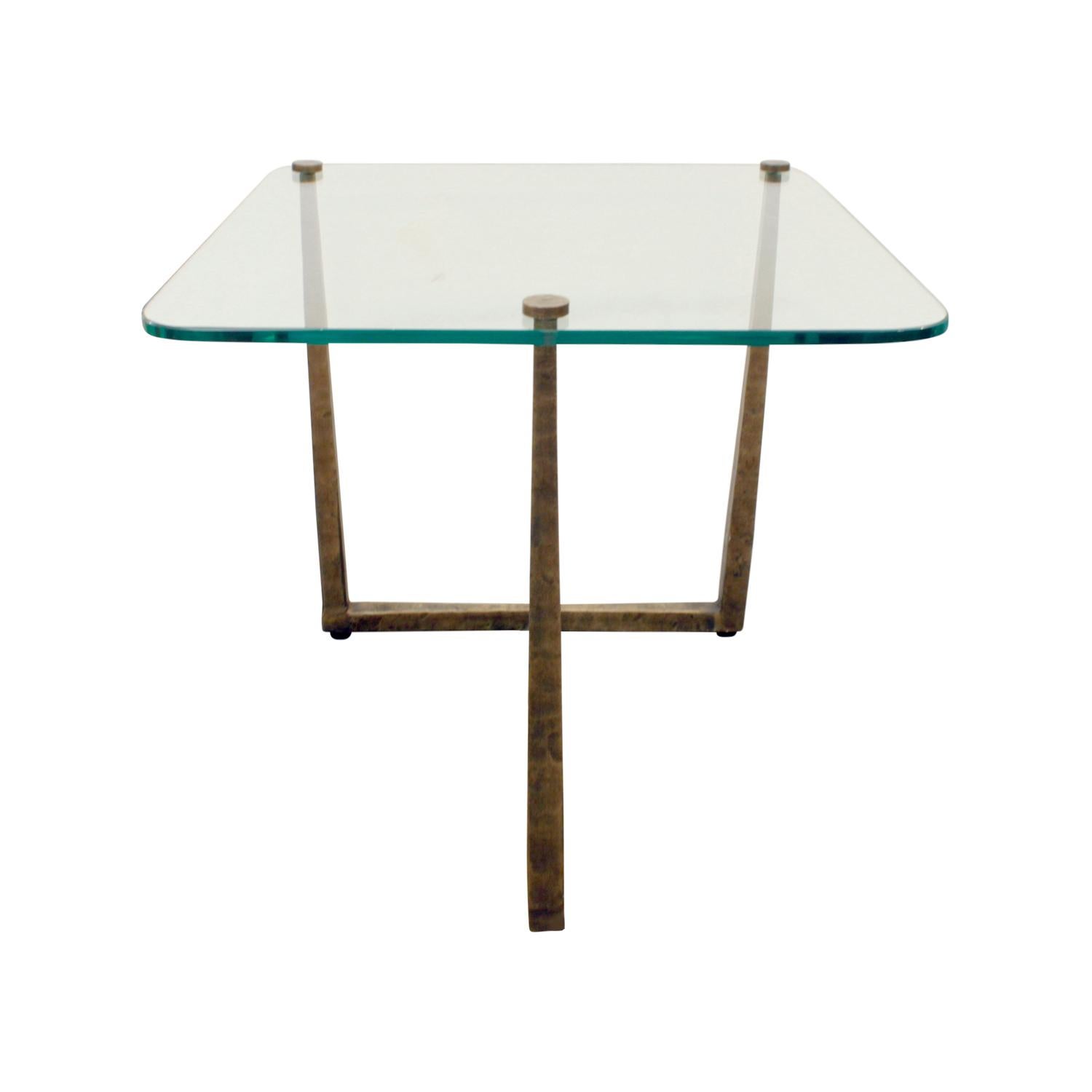 Studio made side table in hammered bronze with custom set glass top, American, 1970s.