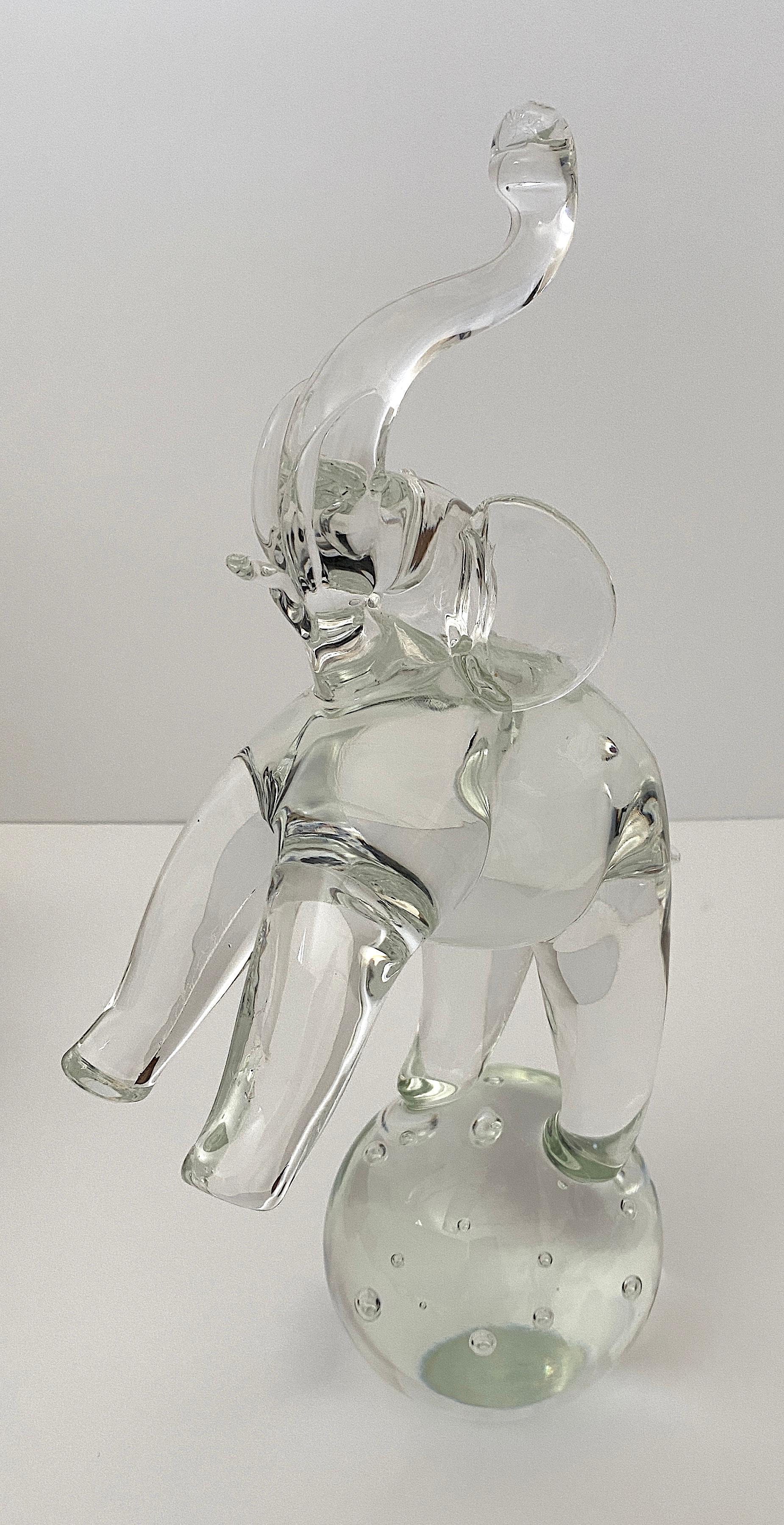 Charming vintage Artisan glass Elephant sculpture on a Controlled Bubble Globe from a Palm Beach estate

Signed on verso - see image.