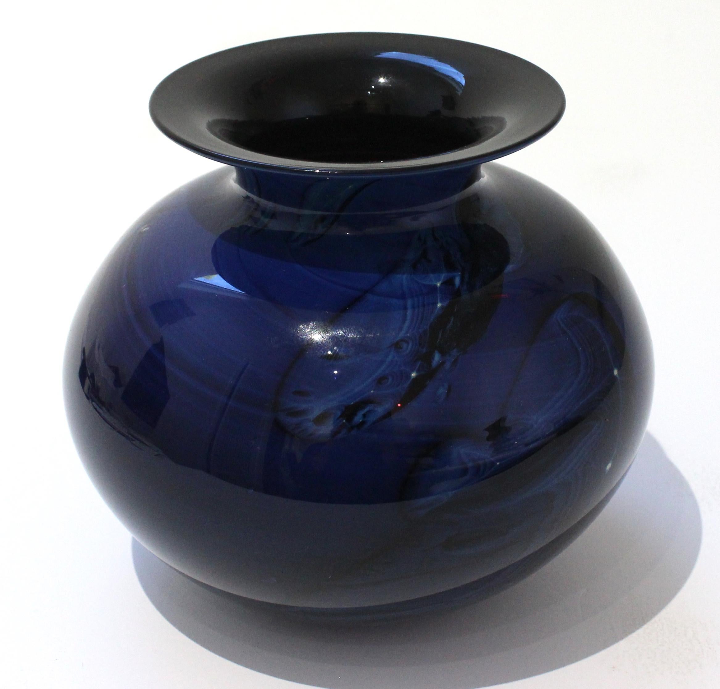 This stylish and chic artisan glass vase dates to 1990 and it will make a subtle statement with its simple form and use of materials. The piece captures a moment in the celestial universe with its coloration and technique.

Note: Title 