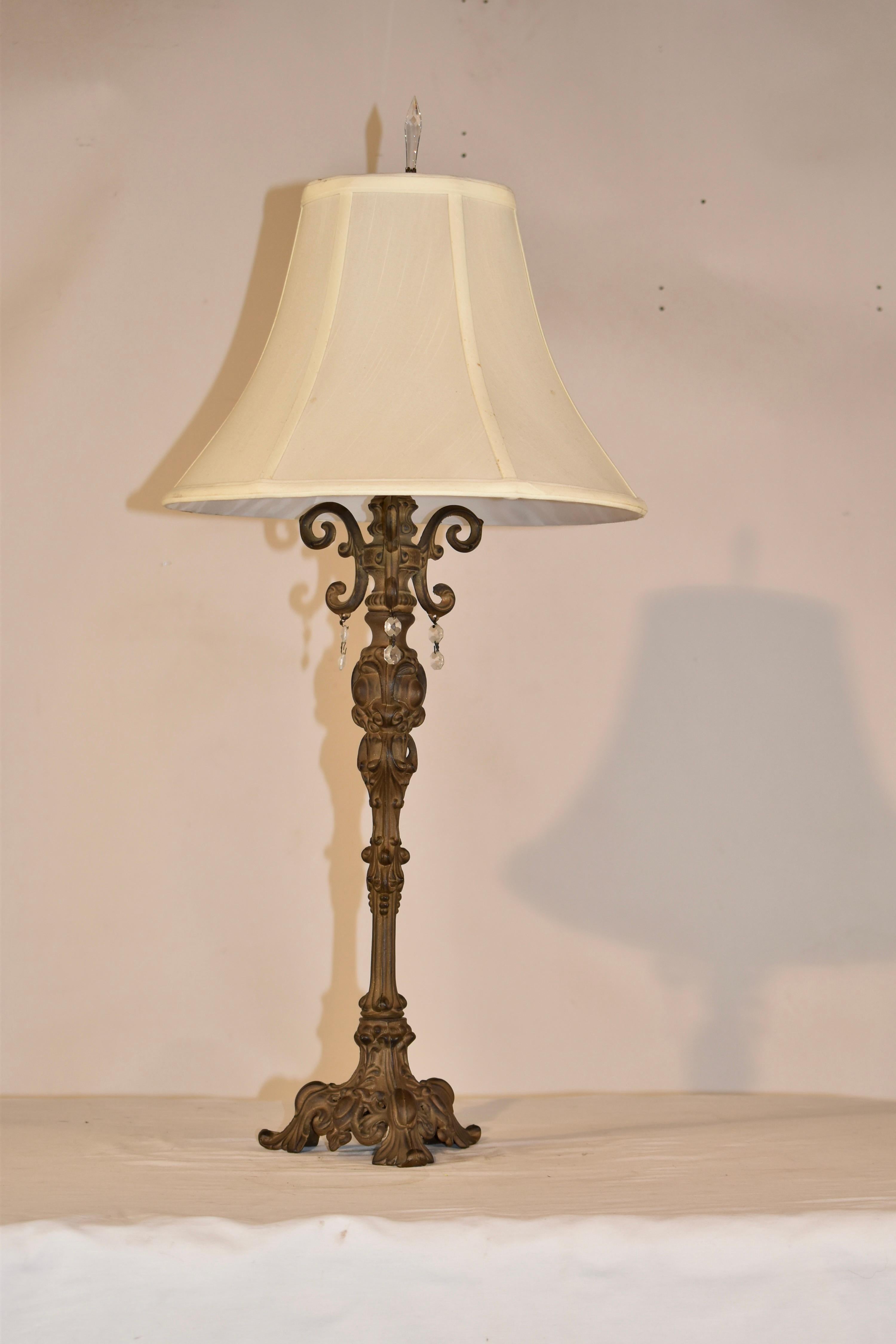 Single Artisan cast metal  lamp with hand rubbed finish.  the shade is made from silk.  Crystal accents are lovely and add a little pizazz.
