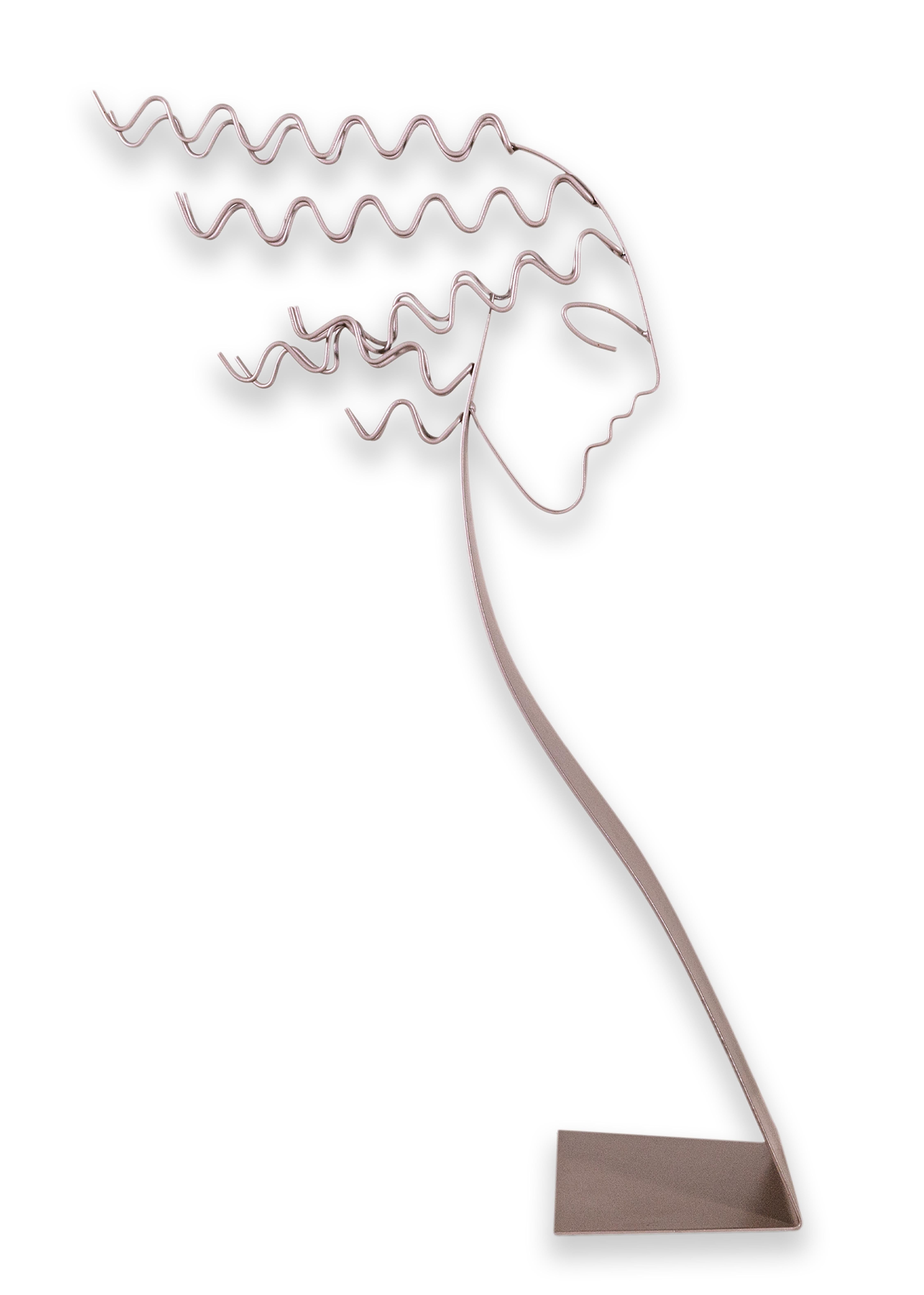 An Artisan House Curtis Jere female silhouette metal sculpture. A lovely table sculpture of a female head. The face looks to the side as the curls of hair blow behind them. This sculpture is fully made of metal, and looks lovely when paired with