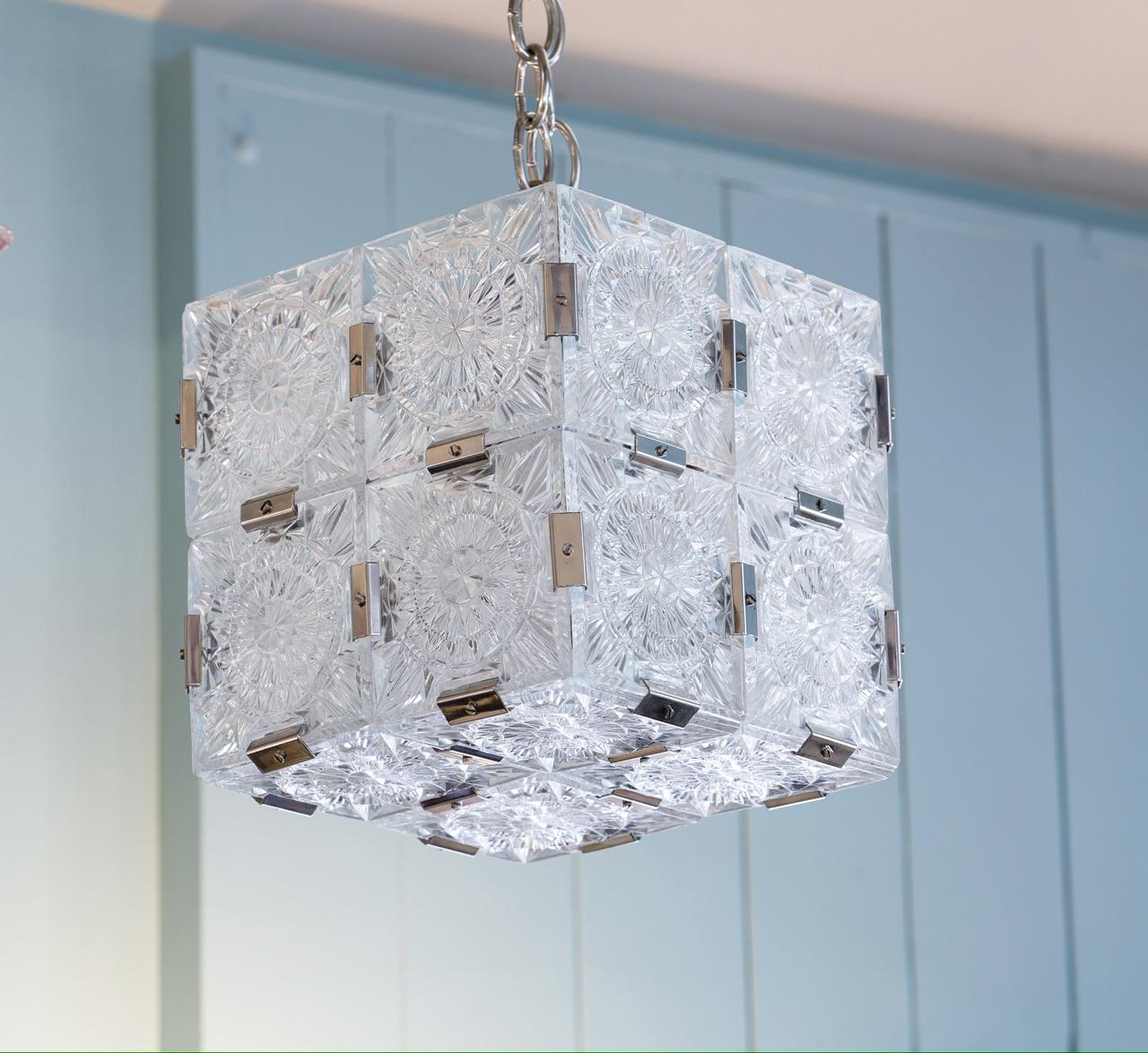 Mid century modern style pressed glass cube pendant. Interesting geometric floral etching design. The cube measures 10.5 by 10.5 by 10.5 and comes with chain and a canopy. Kamenicky Senov  was a region of the Austro-Hungarian Empire well known for