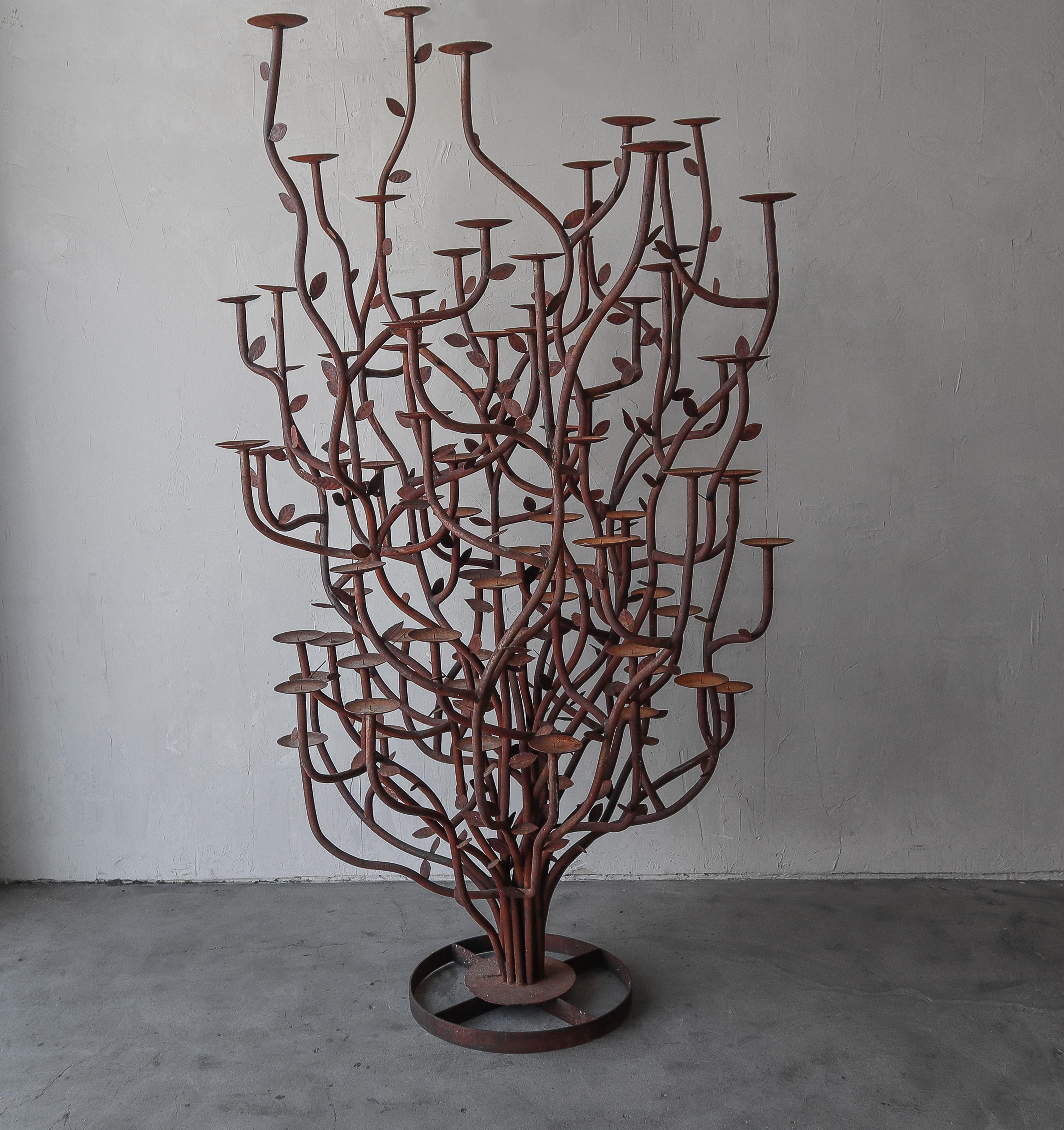 MONUMENTAL artisan made candelabra.  This candelabra is a true piece of art, standing at over 8ft high, it is formed out of iron bent to resemble a tree or bush with branches or leaves.  How incredible would this piece look illuminated?

The