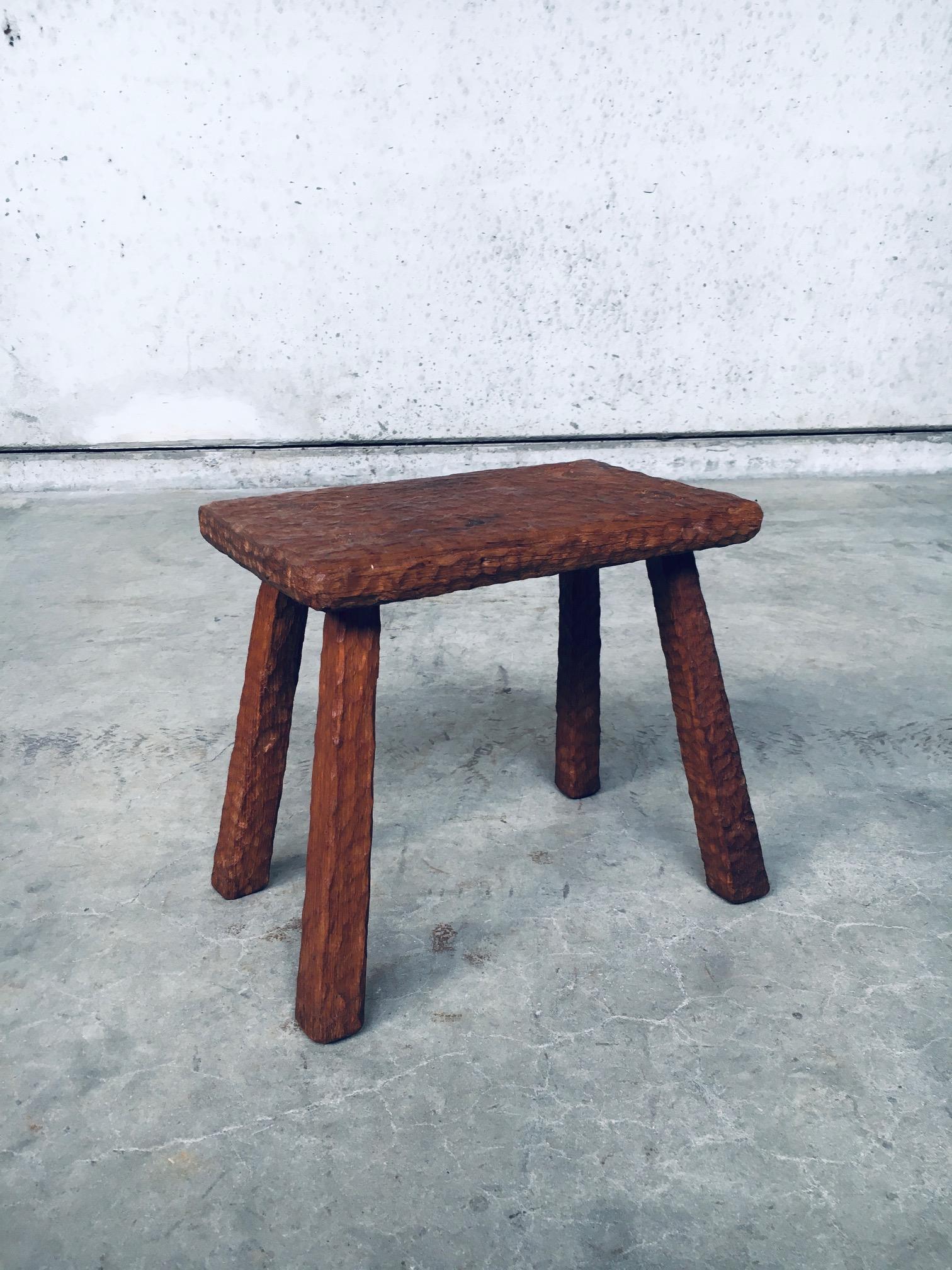 Original Hand Crafted Artisan Made Carved Solid Oak Low Stool or Side Table. Made in Belgium, early 20th Century. Solid oak construction with overal carving, on the top and the legs, which gives this a very nice finish. All original and in good