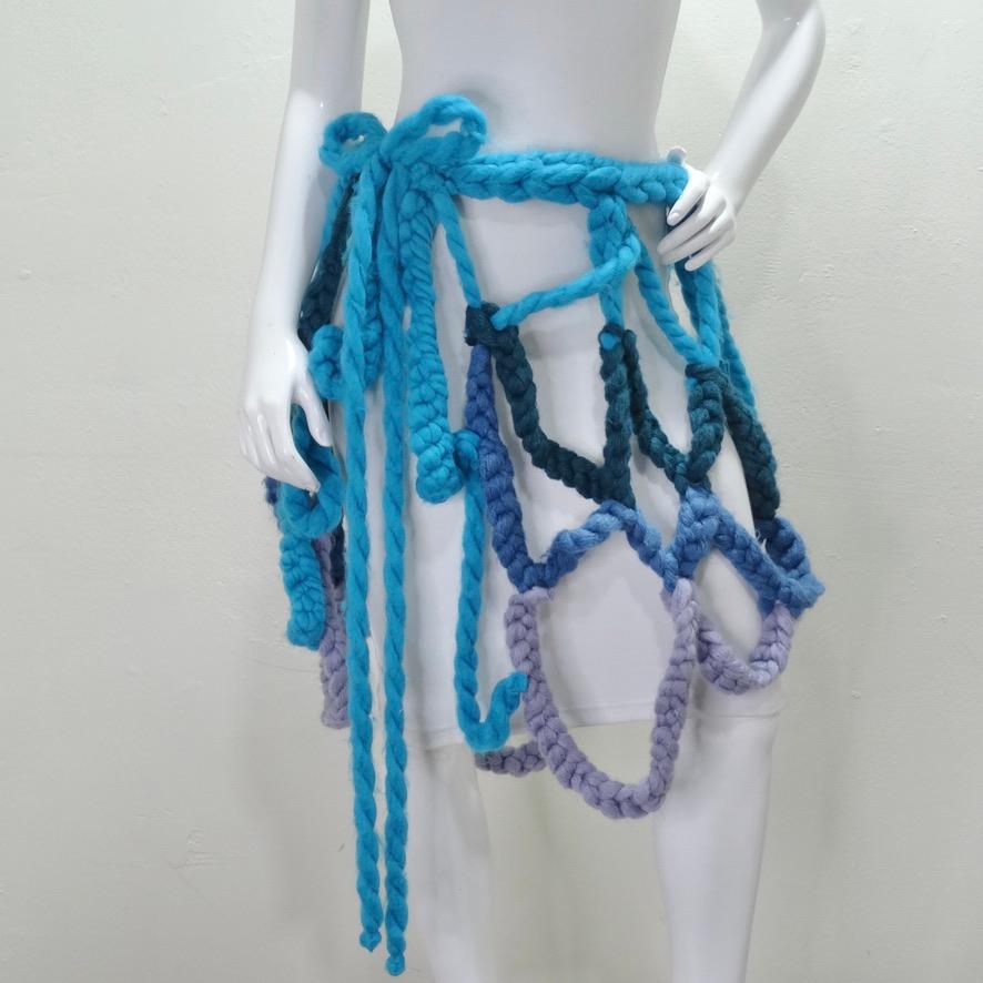 This chunky crochet sarong wrap skirt is begging to be added to your suit case this summer vacation! This special skirt is compromised of a mix of dead-stock thick wool yarns in a cool toned color palette of blues and purples. In a super fun wrap
