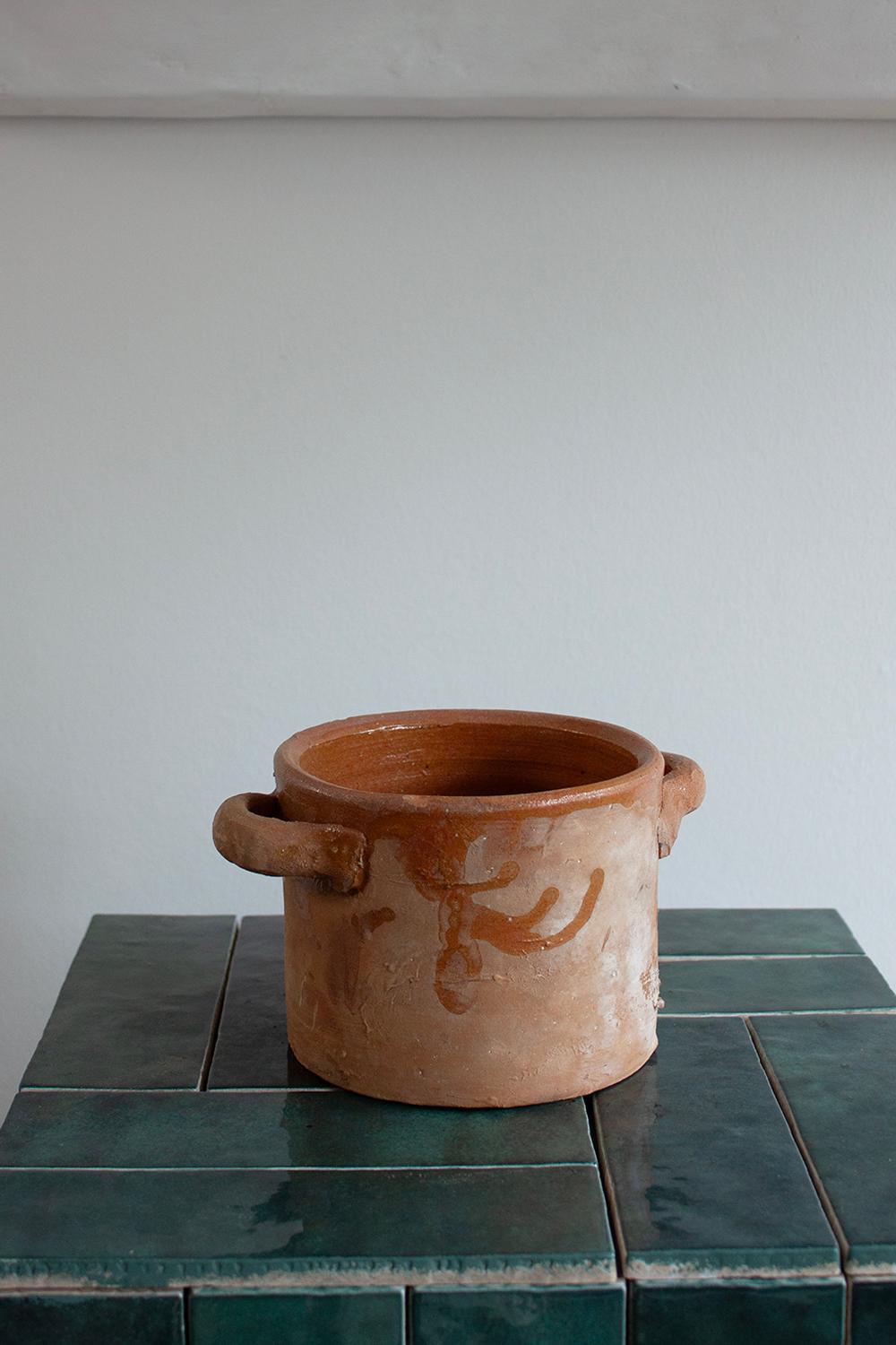 Shipping Note: If your region or country is not listed under the shipping options, please contact us directly.

This charming terracotta kitchen pot has a dark brown glazed which has been dynamically applied. Its size makes it perfect for storing