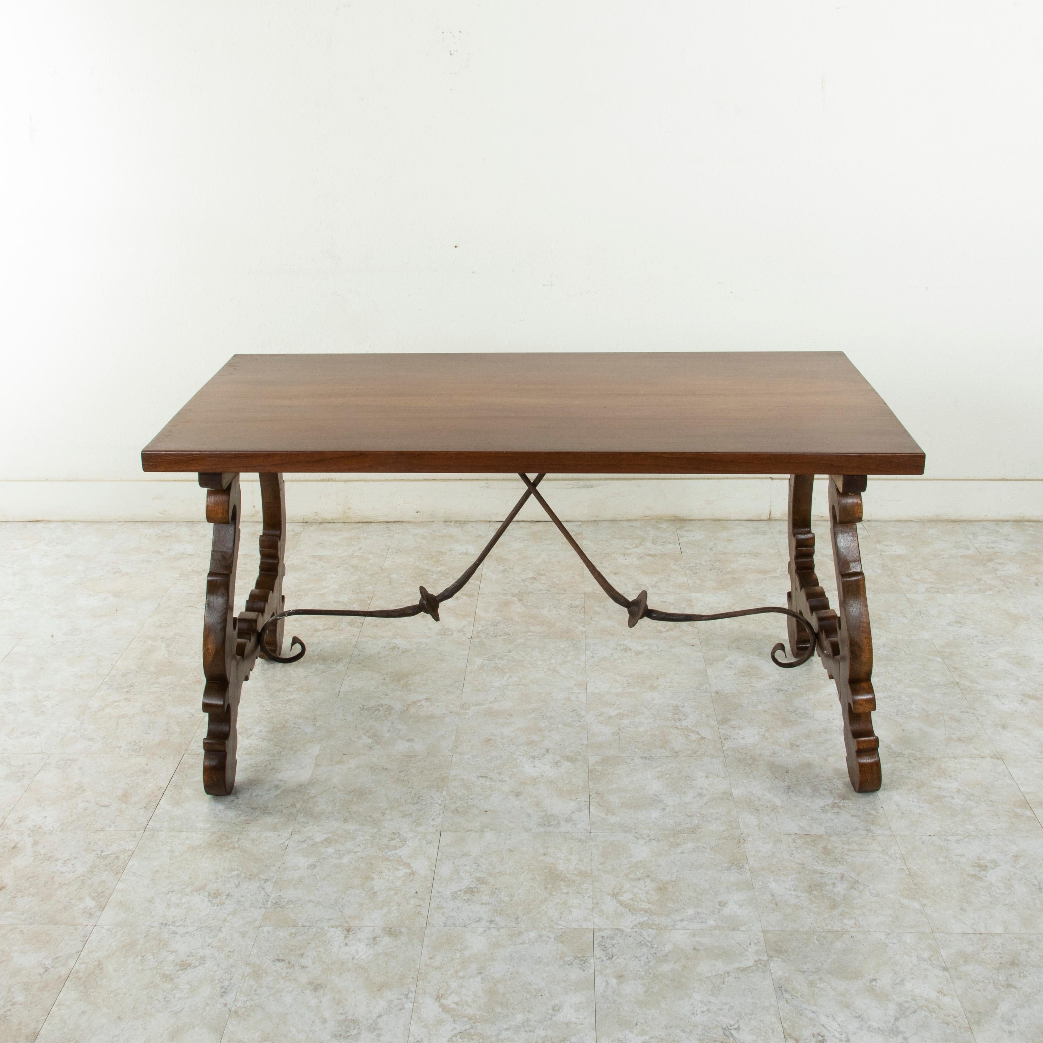 This beautiful artisan-made Spanish Renaissance style table or writing desk from the turn of the twentieth century features a solid amaranth or purple heart top made from a single plank with a width of 31.5 inches. A rare species of wood, the
