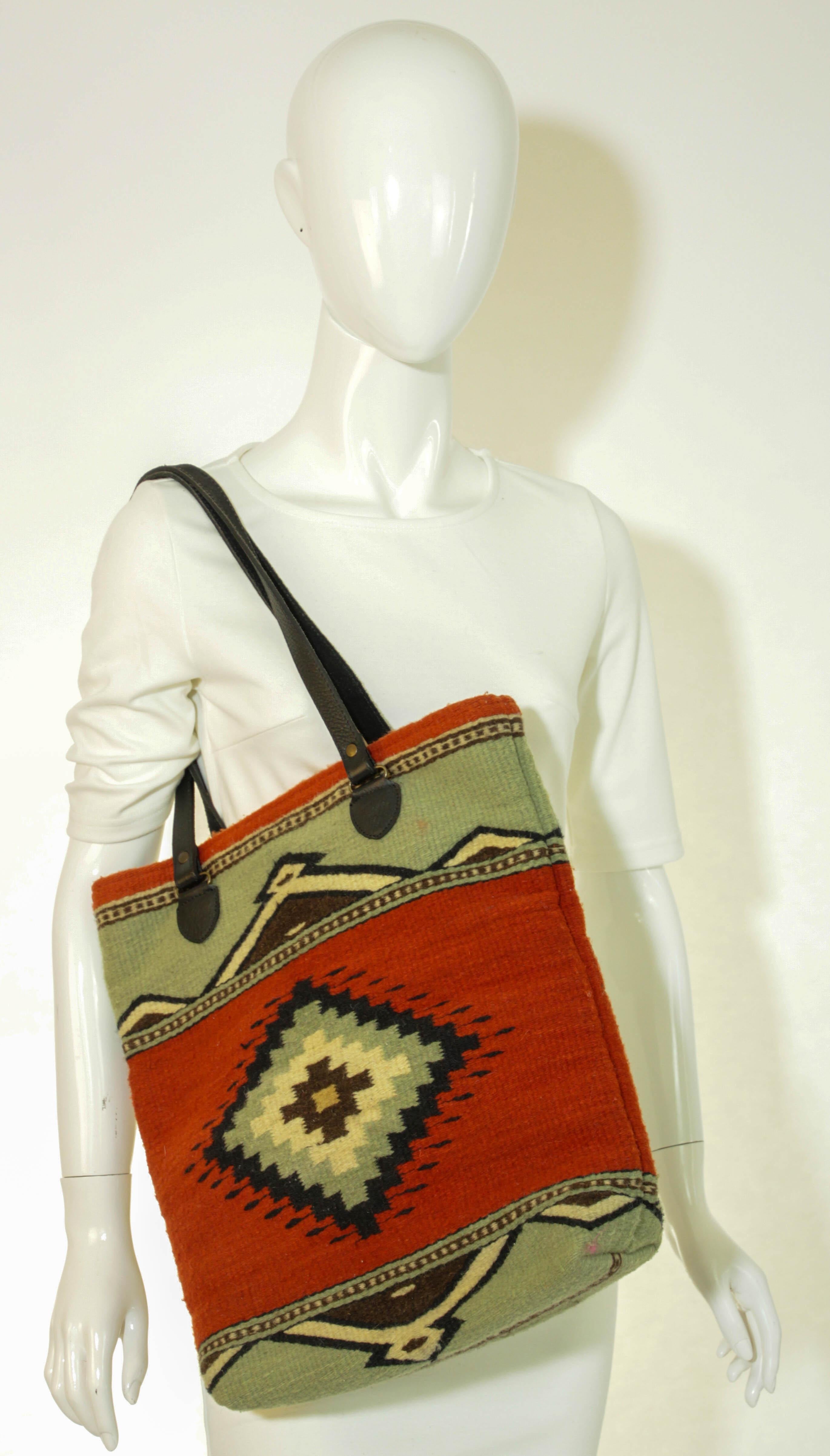 Adobe and Azul Wool Bucket Tote.
From the Yellowstone Spirit Southwestern Collection by MZ Hande made in Mexico.
Step into the rich traditions of Oaxaca with the Artisan-Made Adobe & Azul Shoulder Bag, a stunning blend of cultural heritage and