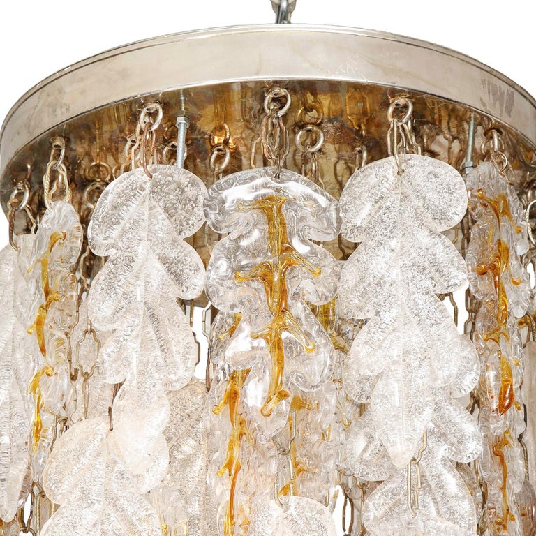 Murano glass cascading pendant fixture with oak leaf motif in clear, frosted and amber glass with steel canopy by Mazzega Murano, Italy 1960's.