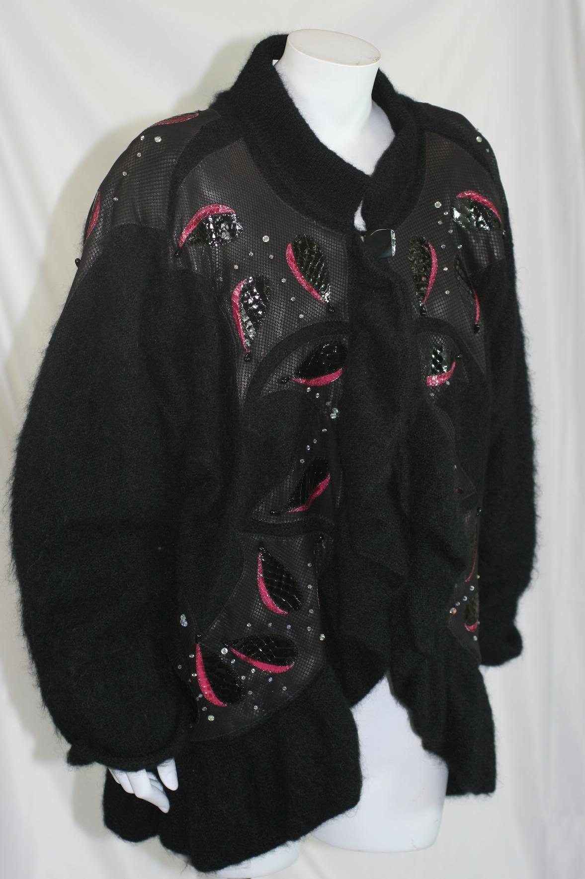 Artisan Mohair and Snakeskin Sweater Jacket. Made in the UK, in mixed materials such as reptile patterned lambskin applique and snakeskin leaves on mohair knit base with Aurora and jet Swarovski crystal beads. Extravagant ruffle along front turns