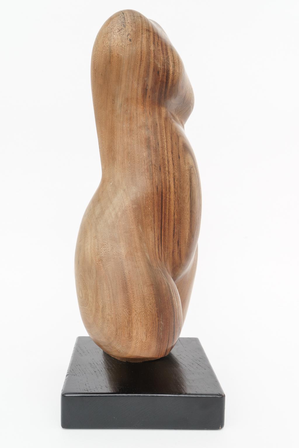 wooden torso sculpture