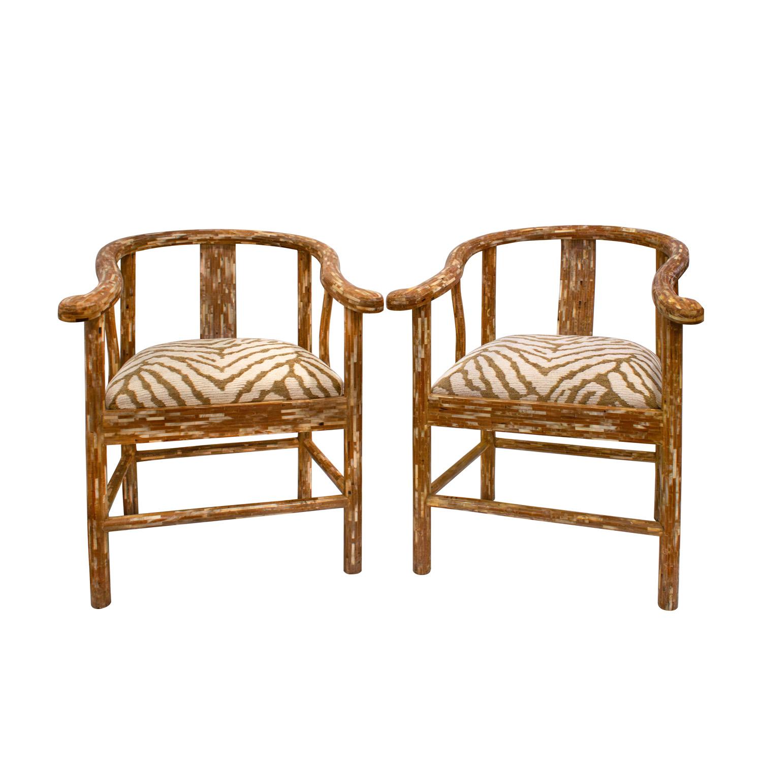 Pair of hand-crafted and chic Chinese style lounge chairs in tessellated horn by Enrique Garcez, Colombia 1970's for the American market. Seats newly reupholstered in luxurious custom fabric. These stunning chairs would work in any style interior.